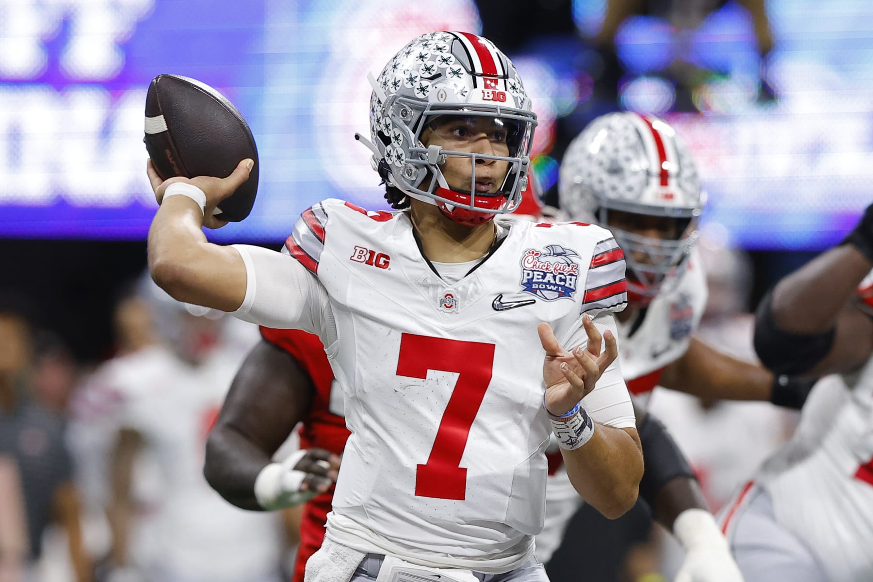 ATLANTA, GA - DECEMBER 31: C.J. Stroud #7 of the Ohio State Buckeyes drops back to pass during the first half against the Georgia Bulldogs in the Chick-fil-A Peach Bowl at Mercedes-Benz Stadium on December 31, 2022 in Atlanta, Georgia. (Photo by Todd Kirkland/Getty Images)