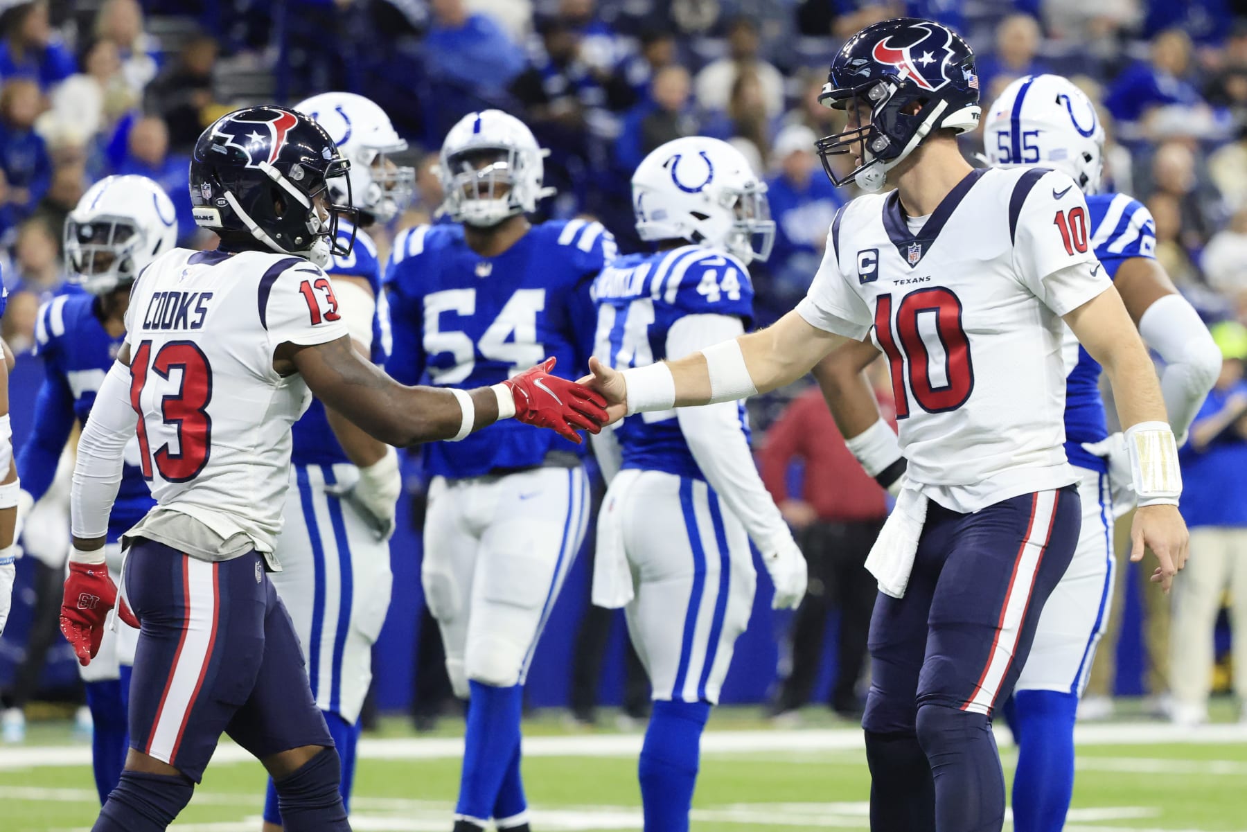INDIANAPOLIS, INDIANA - JANUARY 08: Davis Mills #10 and Brandin Cooks #13 of the Houston Texans celebrate a touchdown during the first quarter of the game against the Indianapolis Colts at Lucas Oil Stadium on January 08, 2023 in Indianapolis, Indiana. (Photo by Justin Casterline/Getty Images)