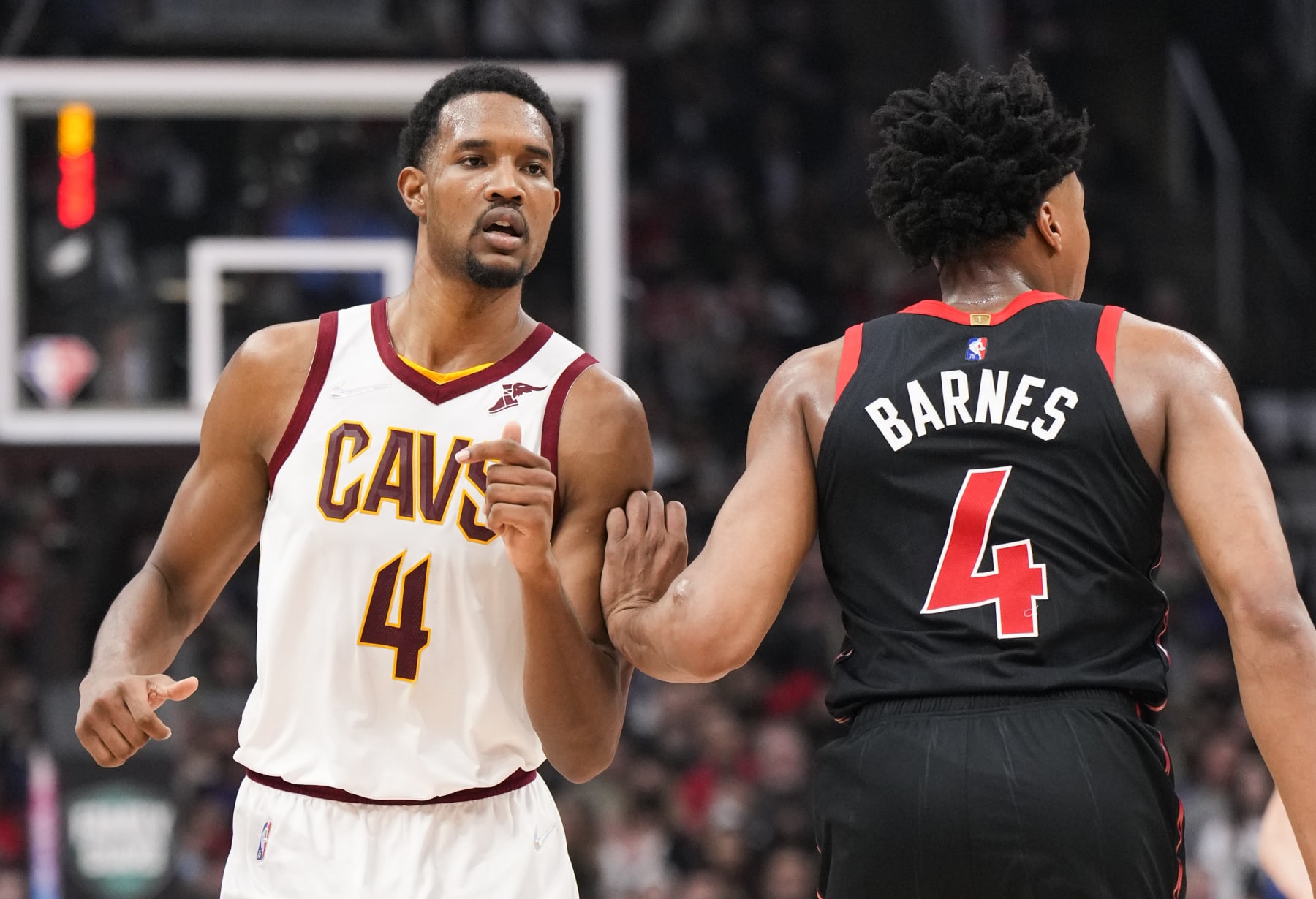 TORONTO, ON - MARCH 24: Evan Mobley #4 of the Cleveland Cavaliers is guarded by Scottie Barnes #4 of the Toronto Raptors during the first half of their basketball game at the Scotiabank Arena on March 24, 2022 in Toronto, Ontario, Canada. NOTE TO USER: User expressly acknowledges and agrees that, by downloading and/or using this Photograph, user is consenting to the terms and conditions of the Getty Images License Agreement. (Photo by Mark Blinch/Getty Images)