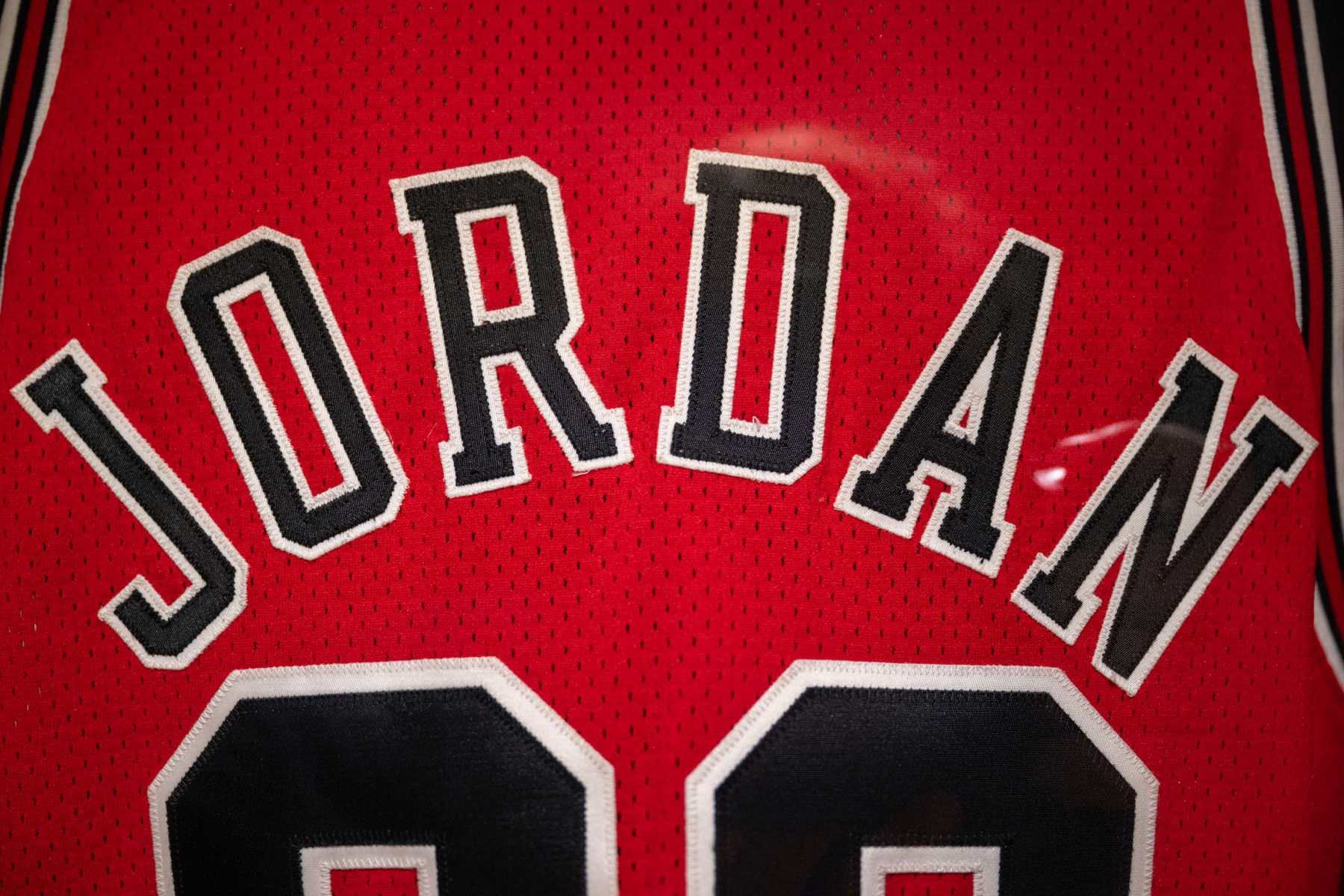 NEW YORK, NEW YORK - SEPTEMBER 06: A close up of Michael Jordan’s game-worn 1998 NBA Finals ‘The Last Dance’ jersey from game 1 is on display during a press preview at Sotheby's on September 06, 2022 in New York City. The jersey is expected to achieve $3-5 million â¨during the Invictus sports auction which will be held from September 6-14. (Photo by Alexi Rosenfeld/Getty Images)