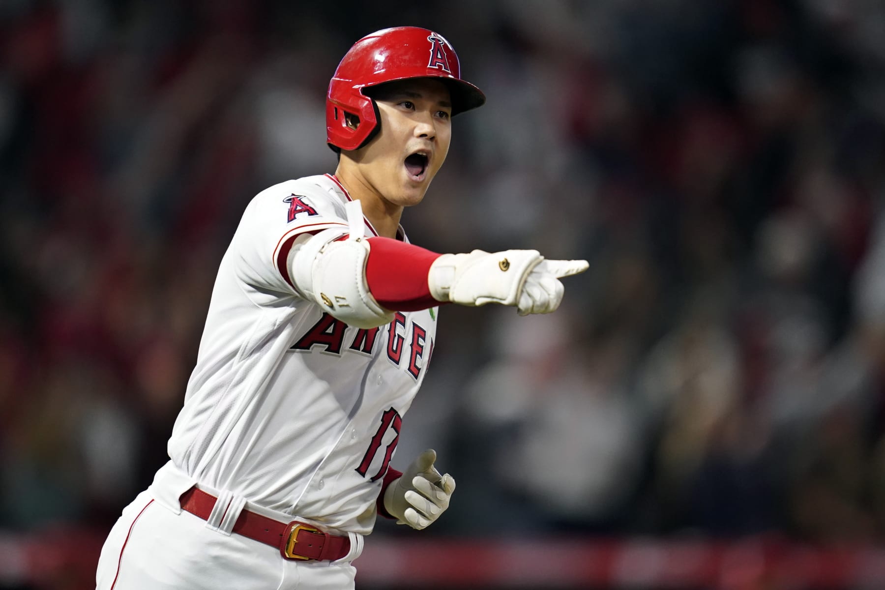 FILE - Los Angeles Angels designated hitter Shohei Ohtani (17) reacts as he runs the bases after hitting a grand slam home run during the seventh inning of a baseball game against the Tampa Bay Rays in Anaheim, Calif., Monday, May 9, 2022. The United States’ Mike Trout and Mookie Betts, Japan’s Shohei Ohtani and Venezuela’s Miguel Cabrera and Jose Altuve are among eight Most Valuable Players on rosters for next month’s World Baseball Classic. (AP Photo/Ashley Landis, File)