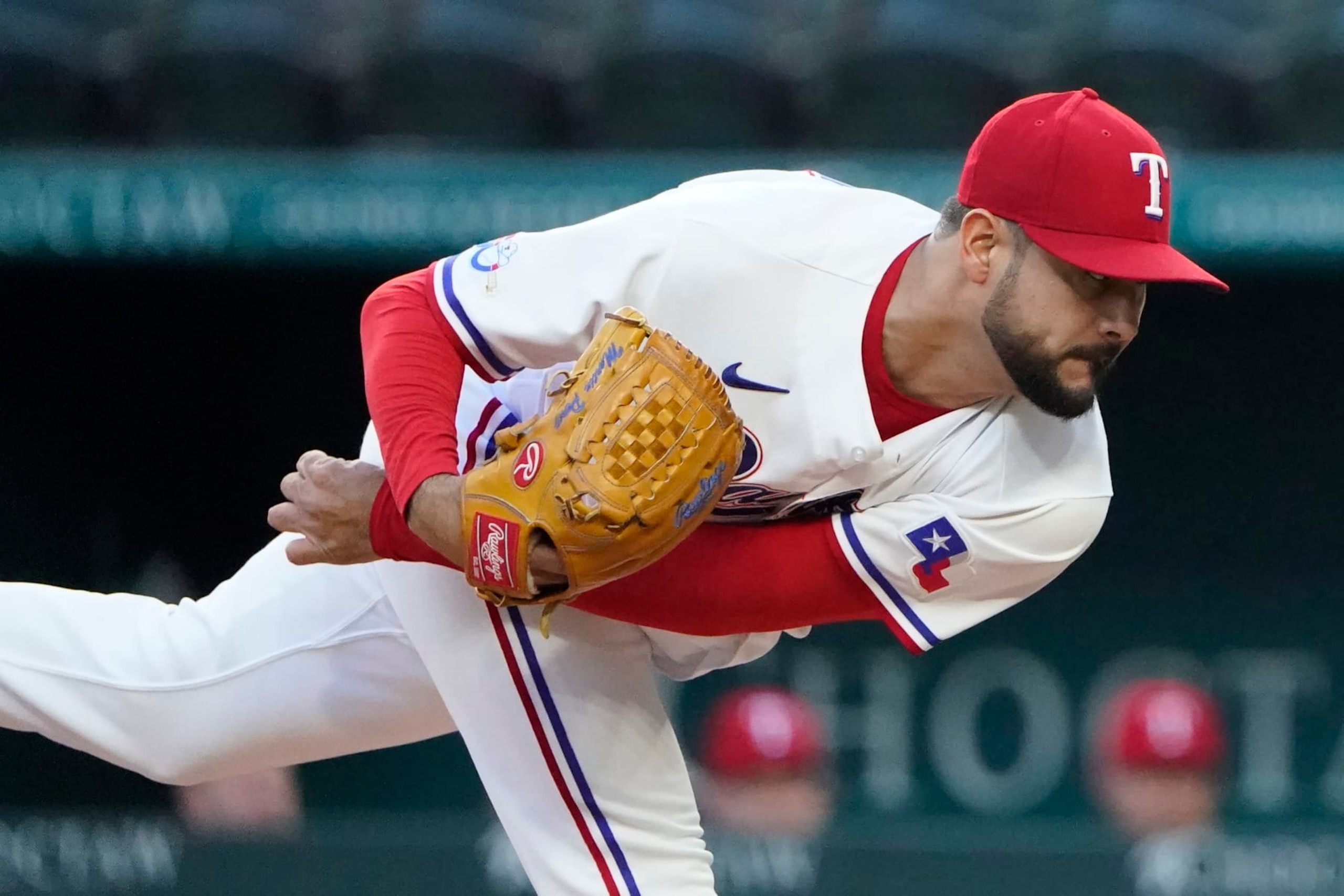 Texas Rangers starting pitcher Martin Perez follows through during the first inning of a baseball game against the New York Yankees in Arlington, Texas, Monday, Oct. 3, 2022. (AP Photo/LM Otero)