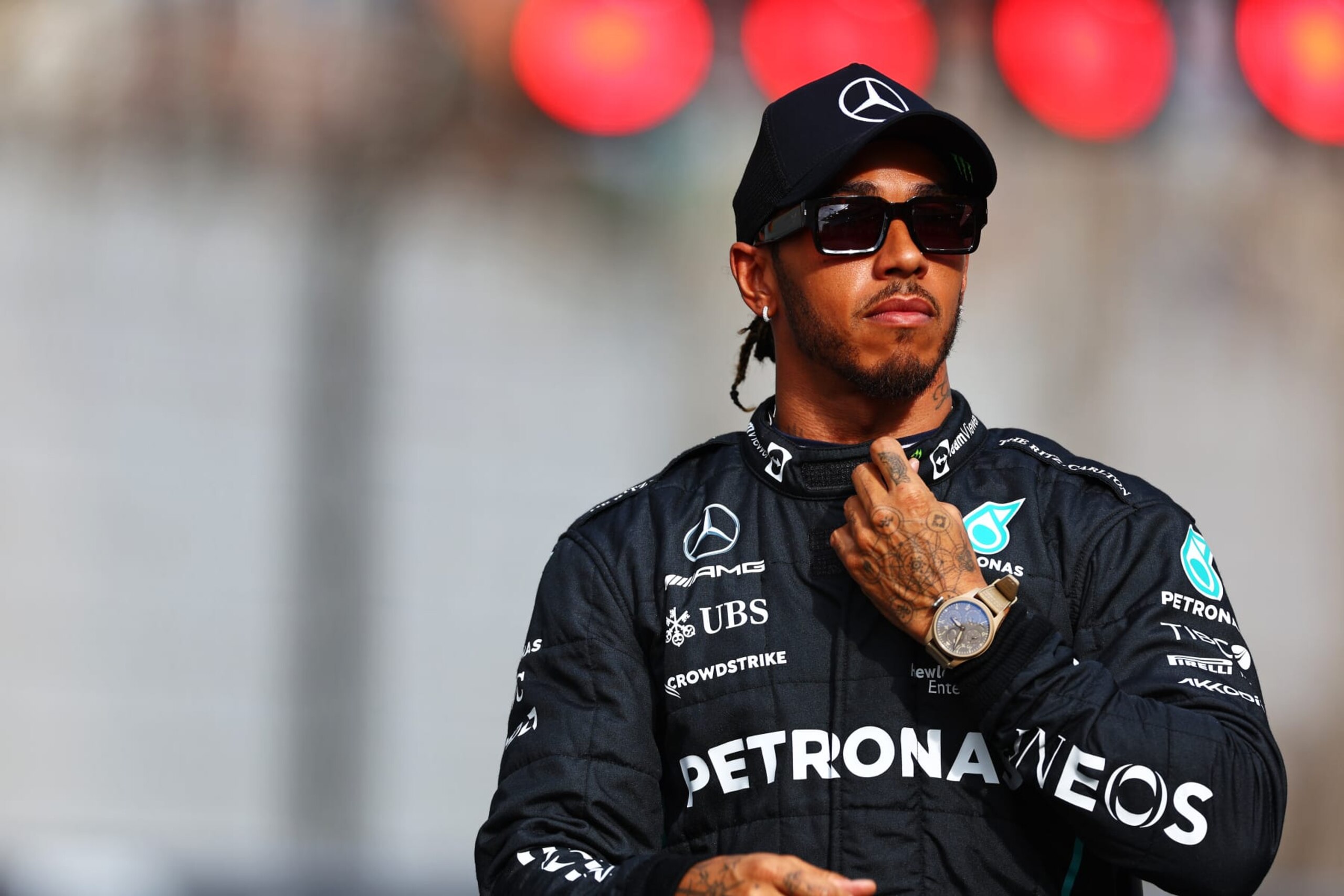 ABU DHABI, UNITED ARAB EMIRATES - NOVEMBER 20: Lewis Hamilton of Great Britain and Mercedes looks on ahead of the F1 2022 End of Year photo prior to the F1 Grand Prix of Abu Dhabi at Yas Marina Circuit on November 20, 2022 in Abu Dhabi, United Arab Emirates. (Photo by Mark Thompson/Getty Images)