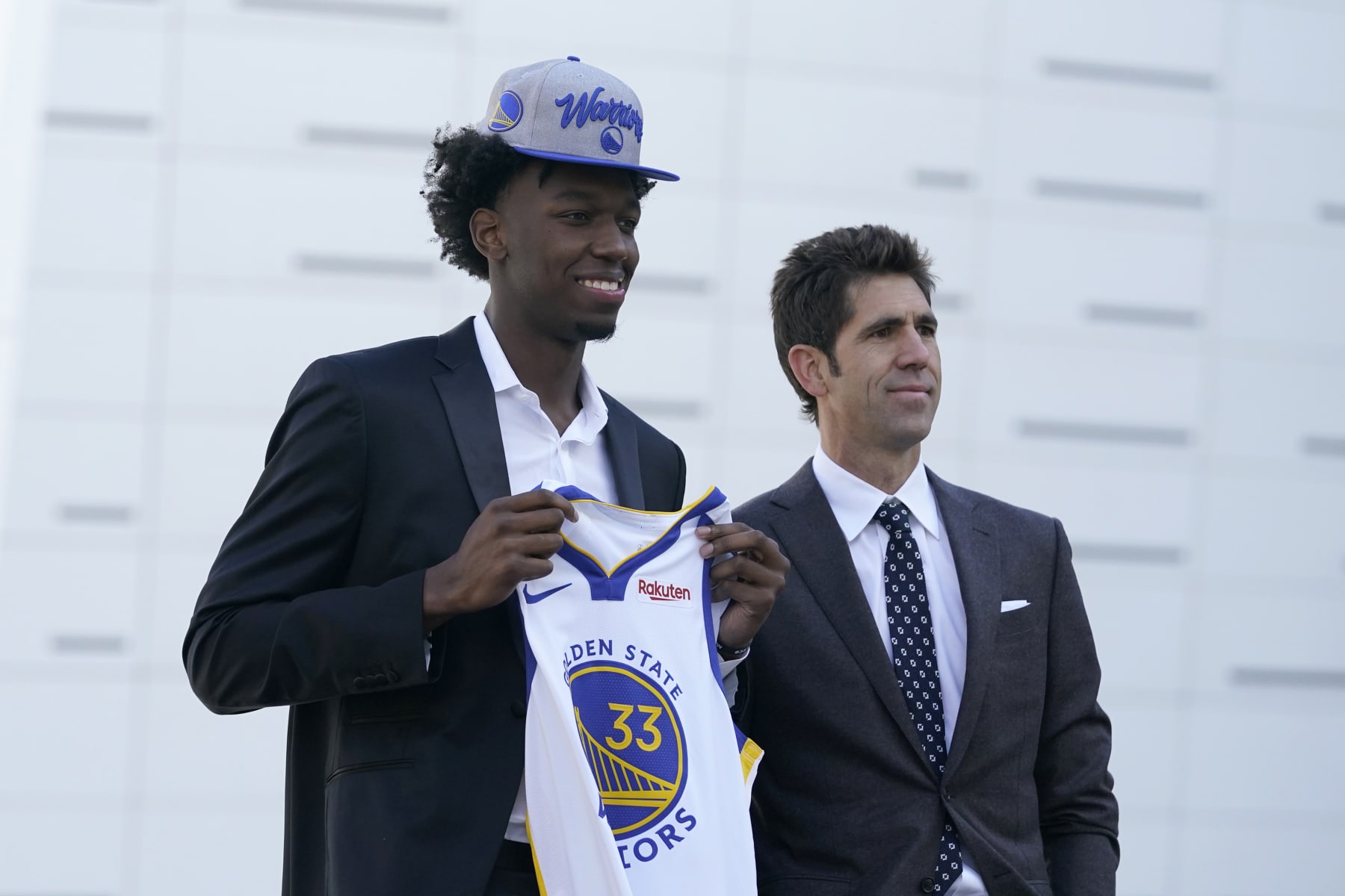 Golden State Warriors draft pick James Wiseman, left, poses next to president of basketball operations and general manager Bob Myers in San Francisco, Thursday, Nov. 19, 2020. (AP Photo/Jeff Chiu)