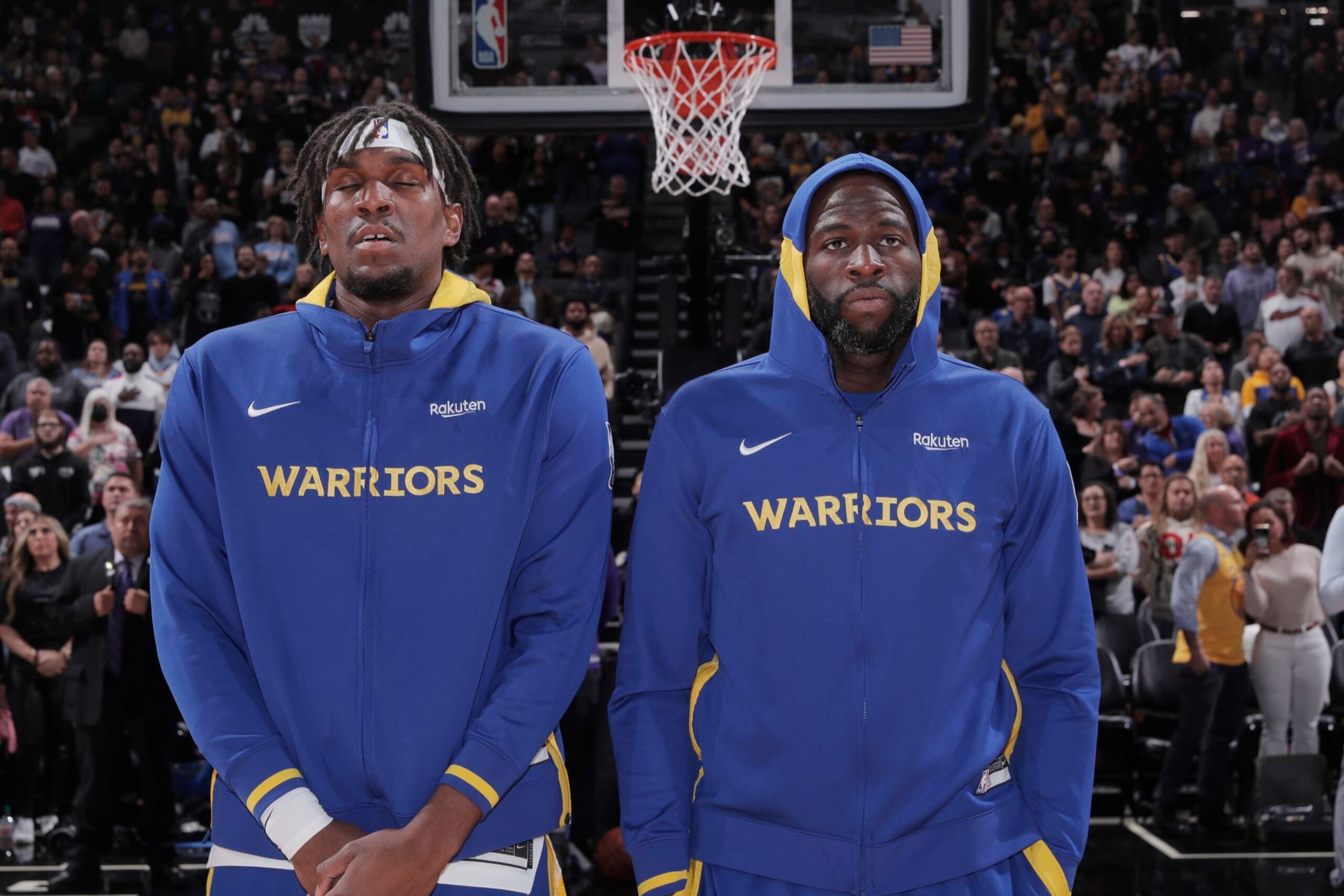 SACRAMENTO, CA - NOVEMBER 13: Kevon Looney #5 and Draymond Green #23 of the Golden State Warriors stand for the National Anthem prior to the game against the Sacramento Kings on November 13, 2022 at Golden 1 Center in Sacramento, California. NOTE TO USER: User expressly acknowledges and agrees that, by downloading and or using this photograph, User is consenting to the terms and conditions of the Getty Images Agreement. Mandatory Copyright Notice: Copyright 2022 NBAE (Photo by Rocky Widner/NBAE via Getty Images)