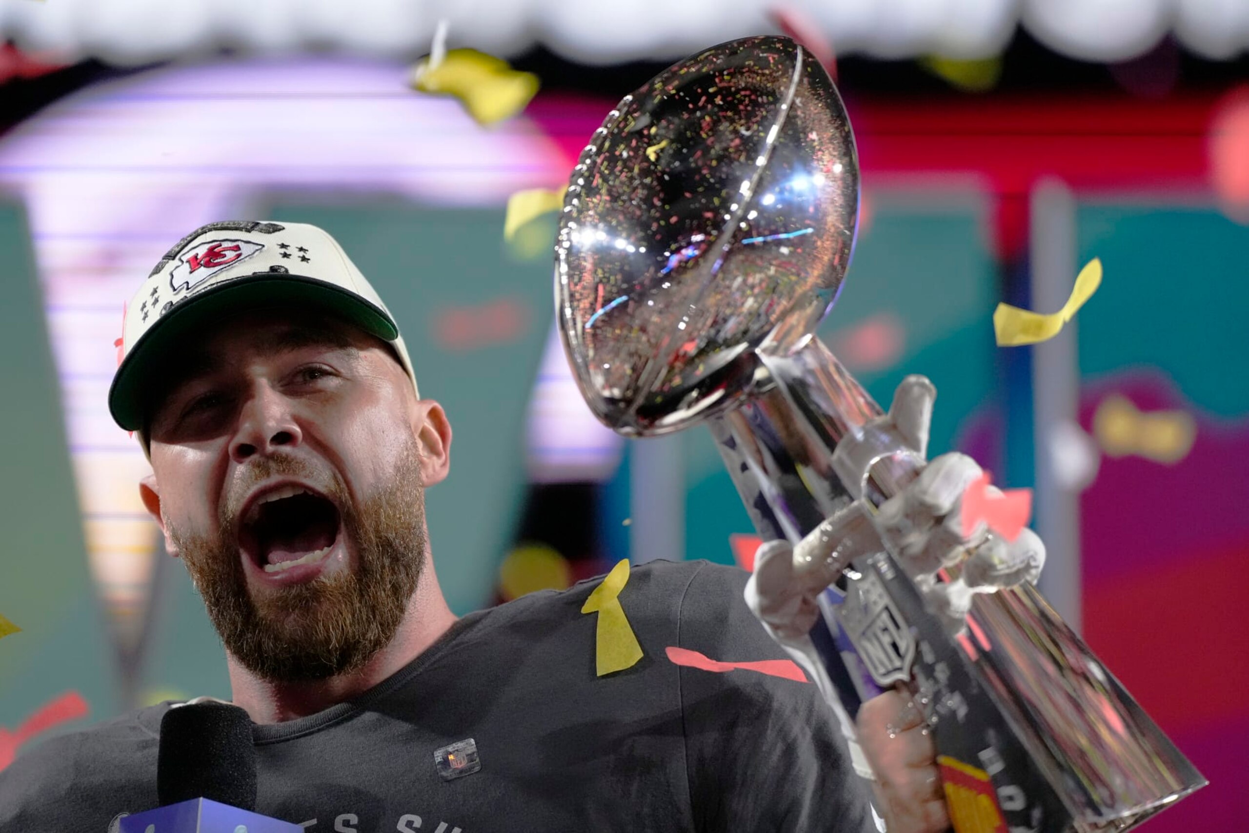 Kansas City Chiefs tight end Travis Kelce (87) celebrates with the trophy after the NFL Super Bowl 57 football game, Sunday, Feb. 12, 2023, in Glendale, Ariz. The Chiefs defeated the Philadelphia Eagles 38-35. (AP Photo/Matt Slocum)