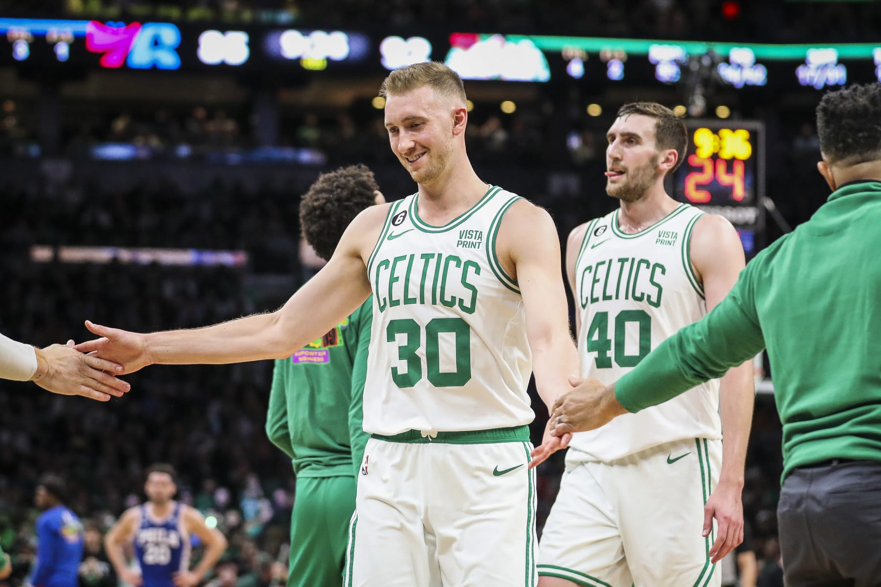 Boston, MA - February 8: Boston Celtics SF Sam Hauser high-fives teammates after hitting a 3-point basket in the fourth quarter. The Celtics beat the Philadelphia 76ers, 106-99. (Photo by Erin Clark/The Boston Globe via Getty Images)