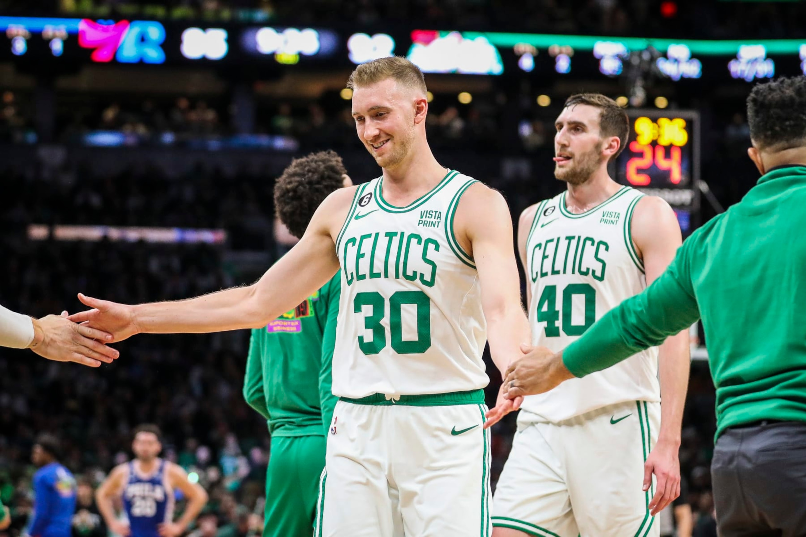 Boston, MA - February 8: Boston Celtics SF Sam Hauser high-fives teammates after hitting a 3-point basket in the fourth quarter. The Celtics beat the Philadelphia 76ers, 106-99. (Photo by Erin Clark/The Boston Globe via Getty Images)
