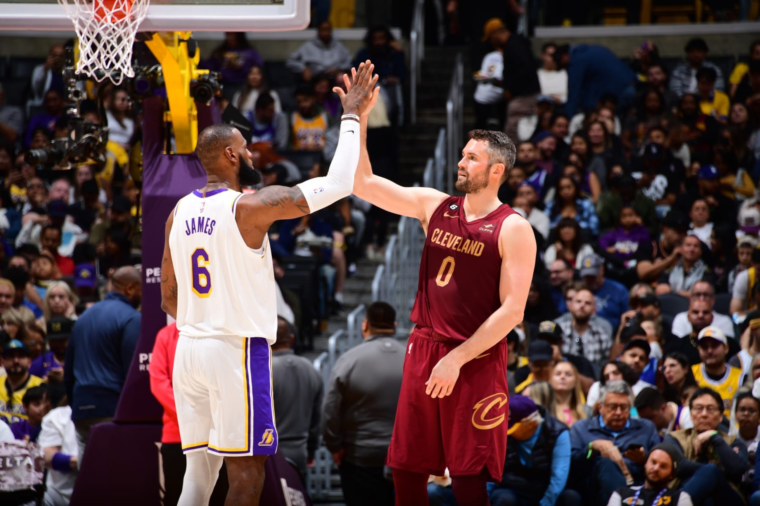 LOS ANGELES, CA - NOVEMBER 6: LeBron James #6 of the Los Angeles Lakers high fives Kevin Love #0 of the Cleveland Cavaliers during the game on November 6, 2022 at Crypto.Com Arena in Los Angeles, California. NOTE TO USER: User expressly acknowledges and agrees that, by downloading and/or using this Photograph, user is consenting to the terms and conditions of the Getty Images License Agreement. Mandatory Copyright Notice: Copyright 2022 NBAE (Photo by Adam Pantozzi/NBAE via Getty Images) LOS ANGELES, CA - NOVEMBER 6: LeBron James #6 of the Los Angeles Lakers high fives Kevin Love #0 of the Cleveland Cavaliers during the game on November 6, 2022 at Crypto.Com Arena in Los Angeles, California. NOTE TO USER: User expressly acknowledges and agrees that, by downloading and/or using this Photograph, user is consenting to the terms and conditions of the Getty Images License Agreement. Mandatory Copyright Notice: Copyright 2022 NBAE (Photo by Adam Pantozzi/NBAE via Getty Images)