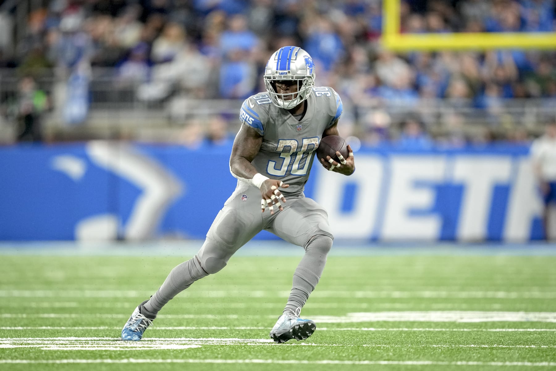 DETROIT, MICHIGAN - NOVEMBER 24: Jamaal Williams #30 of the Detroit Lions runs the ball against the Buffalo Bills at Ford Field on November 24, 2022 in Detroit, Michigan. (Photo by Nic Antaya/Getty Images)