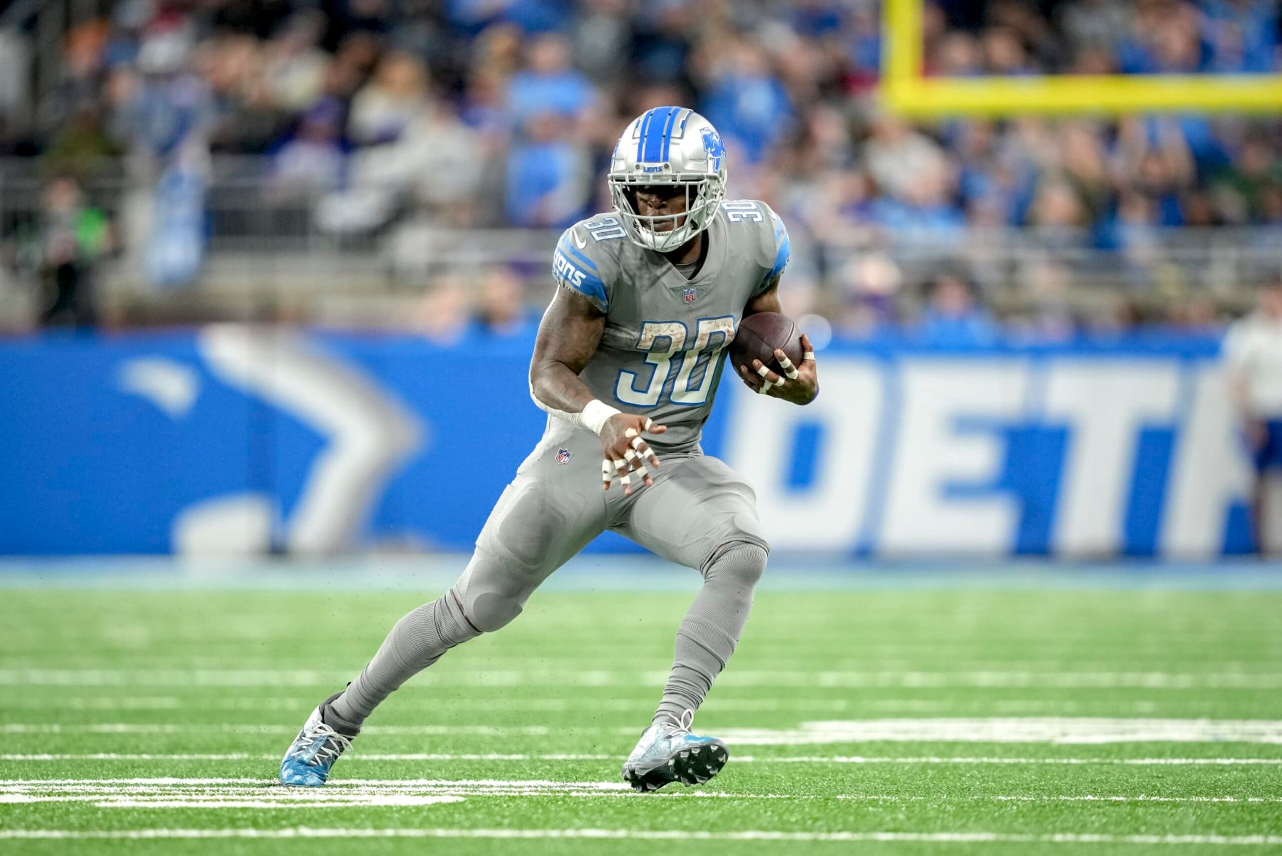 DETROIT, MICHIGAN - NOVEMBER 24: Jamaal Williams #30 of the Detroit Lions runs the ball against the Buffalo Bills at Ford Field on November 24, 2022 in Detroit, Michigan. (Photo by Nic Antaya/Getty Images)
