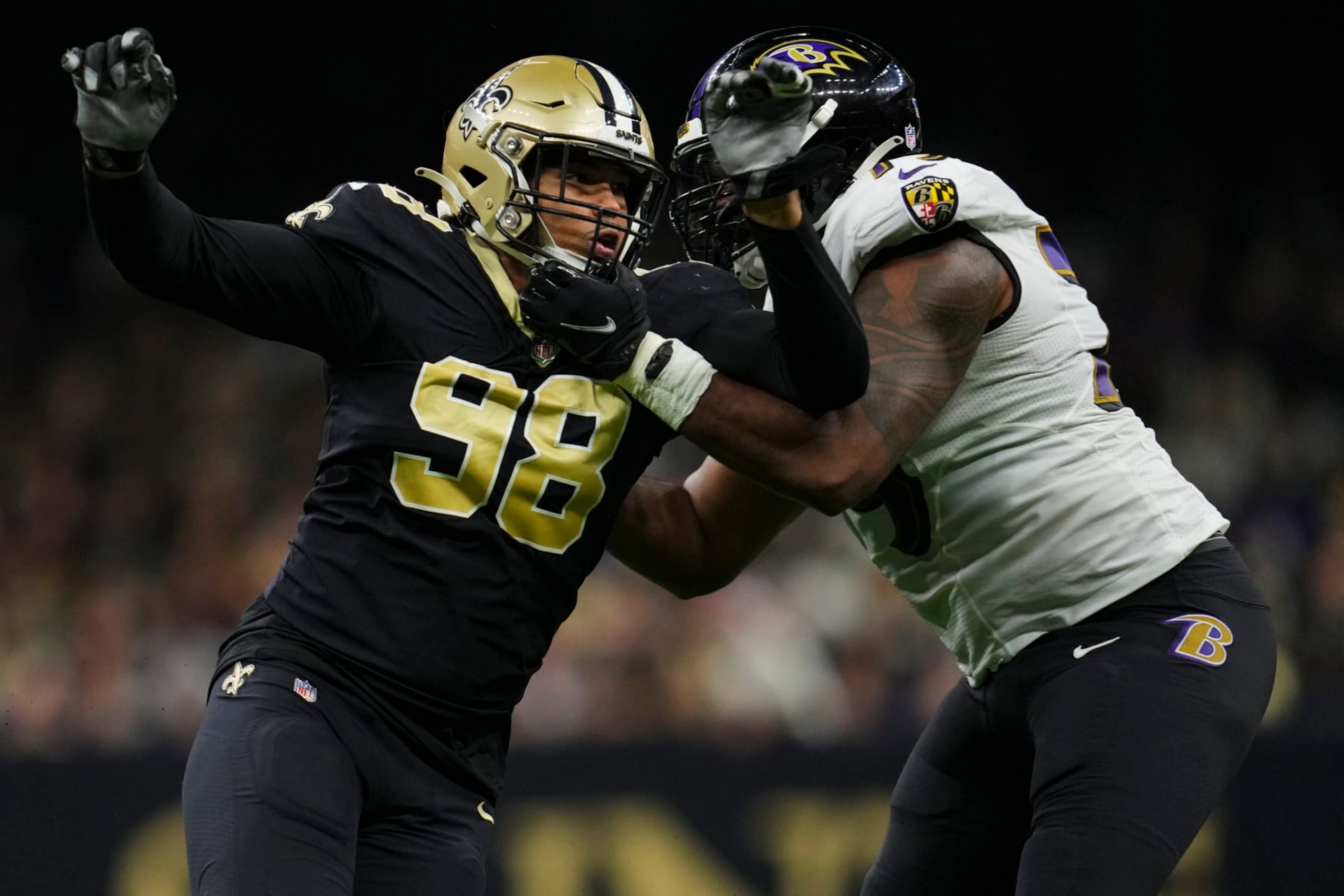 NEW ORLEANS, LA - NOVEMBER 07: Payton Turner #98 of the New Orleans Saints battles with Ronnie Stanley #79 of the Baltimore Ravens at Caesars Superdome on November 7, 2022 in New Orleans, Louisiana. (Photo by Cooper Neill/Getty Images)