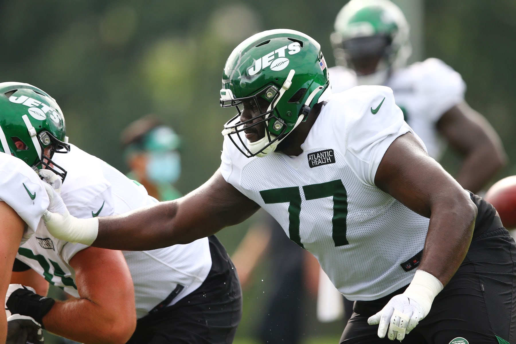 FLORHAM PARK, NEW JERSEY - AUGUST 23: Mekhi Becton #77 of the New York Jets runs drills at Atlantic Health Jets Training Center on August 23, 2020 in Florham Park, New Jersey. (Photo by Mike Stobe/Getty Images)