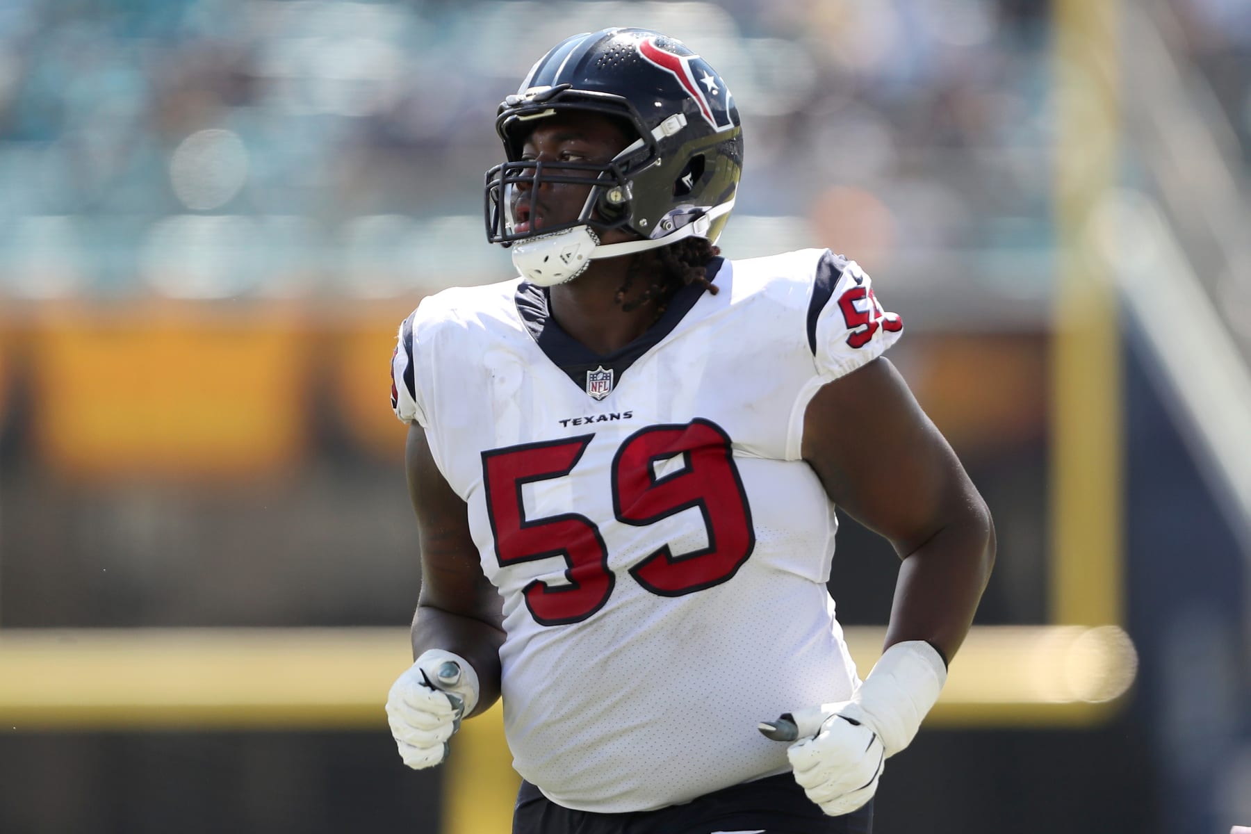 JACKSONVILLE, FLORIDA - OCTOBER 09: Kenyon Green #59 of the Houston Texans leaves the field at halftime during the game against the Jacksonville Jaguars at TIAA Bank Field on October 09, 2022 in Jacksonville, Florida. (Photo by Courtney Culbreath/Getty Images)