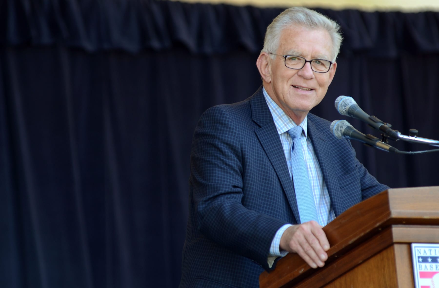 Tim McCarver accepts the 2012 Ford C. Frick Award for excellence in baseball broadcasting as part of the Baseball Hall of Fame Induction ceremonies at Doubleday Field in Cooperstown, N.Y., Saturday, July 21, 2012. (AP Photo/Heather Ainsworth)
