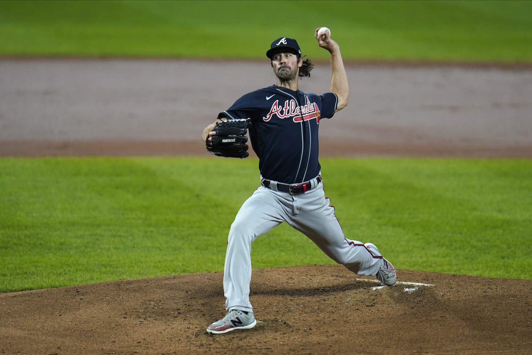 Atlanta Braves starting pitcher Cole Hamels throws a pitch to the Baltimore Orioles during the second inning of a baseball game, Wednesday, Sept. 16, 2020, in Baltimore. (AP Photo/Julio Cortez)