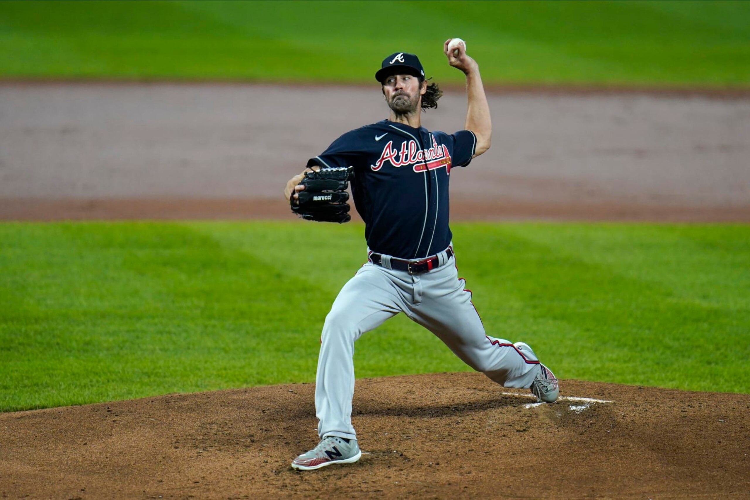 Atlanta Braves starting pitcher Cole Hamels throws a pitch to the Baltimore Orioles during the second inning of a baseball game, Wednesday, Sept. 16, 2020, in Baltimore. (AP Photo/Julio Cortez)