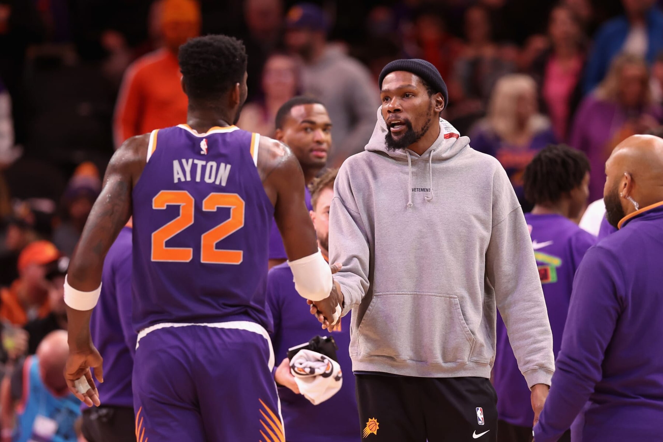 PHOENIX, ARIZONA - FEBRUARY 14: Kevin Durant #35 of the Phoenix Suns high fives Deandre Ayton #22 after scoring against the Sacramento Kings during the first half of the NBA game at Footprint Center on February 14, 2023 in Phoenix, Arizona. NOTE TO USER: User expressly acknowledges and agrees that, by downloading and or using this photograph, User is consenting to the terms and conditions of the Getty Images License Agreement. (Photo by Christian Petersen/Getty Images)