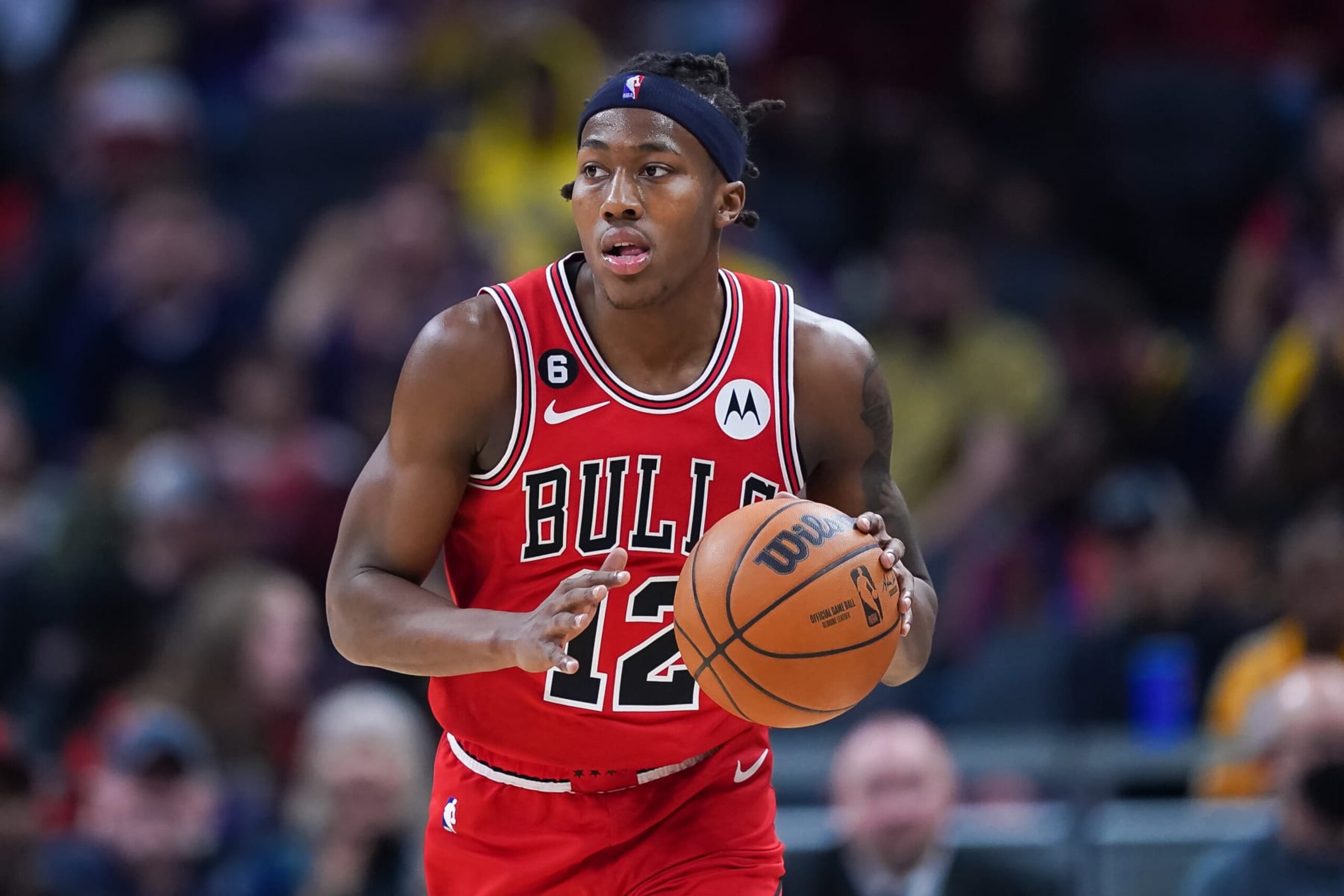 INDIANAPOLIS, INDIANA - FEBRUARY 15: Ayo Dosunmu #12 of the Chicago Bulls dribbles the ball in the second quarter against the Indiana Pacers at Gainbridge Fieldhouse on February 15, 2023 in Indianapolis, Indiana. NOTE TO USER: User expressly acknowledges and agrees that, by downloading and or using this photograph, User is consenting to the terms and conditions of the Getty Images License Agreement. (Photo by Dylan Buell/Getty Images)