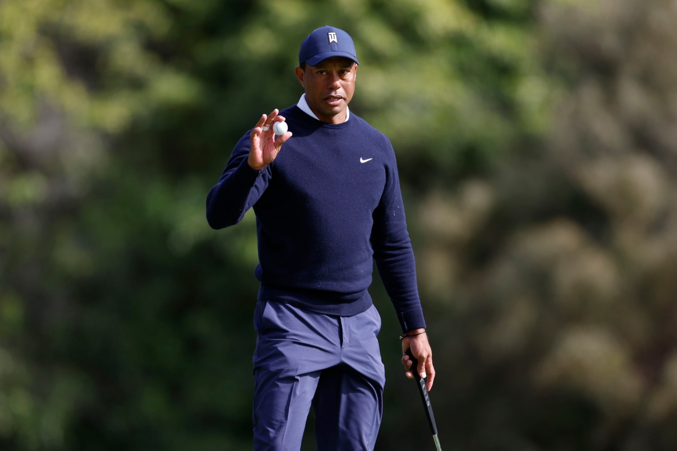 Tiger Woods acknowledges the gallery on the ninth hole during the first round of the Genesis Invitational golf tournament at Riviera Country Club, Thursday, Feb. 16, 2023, in the Pacific Palisades area of Los Angeles. (AP Photo/Ryan Kang)