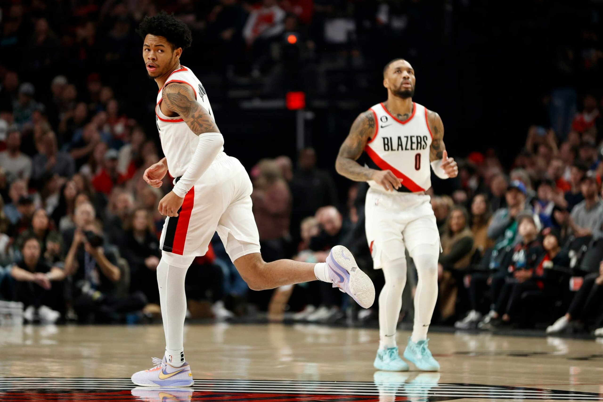 Anfernee Simons and Damian Lillard. Anfernee Simons and Damian Lillard.