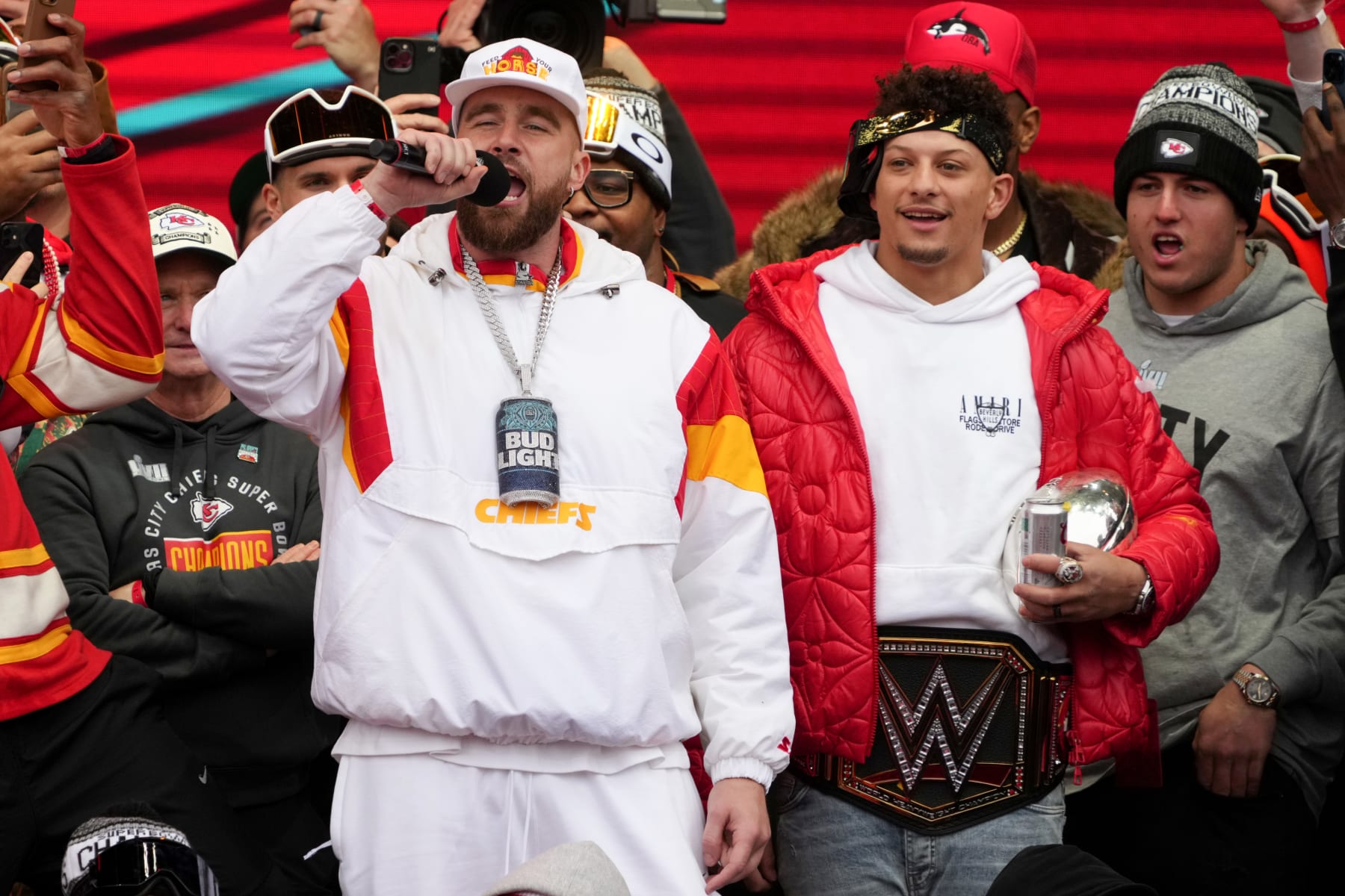 KANSAS CITY, MISSOURI - FEBRUARY 15: Travis Kelce #87 and Patrick Mahomes #15 of the Kansas City Chiefs celebrate on stage during the Kansas City Chiefs Super Bowl LVII victory parade on February 15, 2023 in Kansas City, Missouri. (Photo by Jay Biggerstaff/Getty Images)