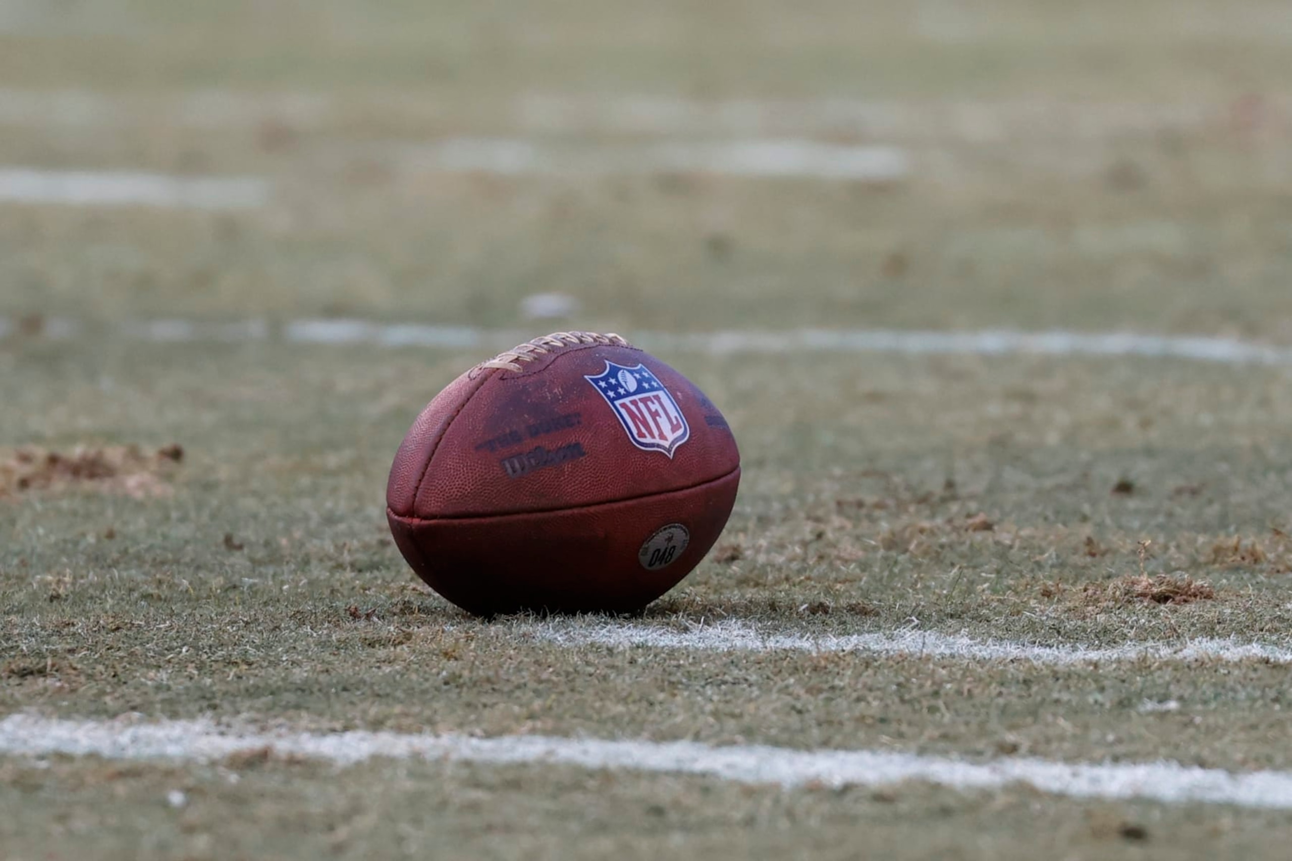 Wilson football sits on the field during the first half of an NFL football game between the Chicago Bears and Minnesota Vikings, Sunday, Jan. 8, 2023, in Chicago. (AP Photo/Kamil Krzaczynski)