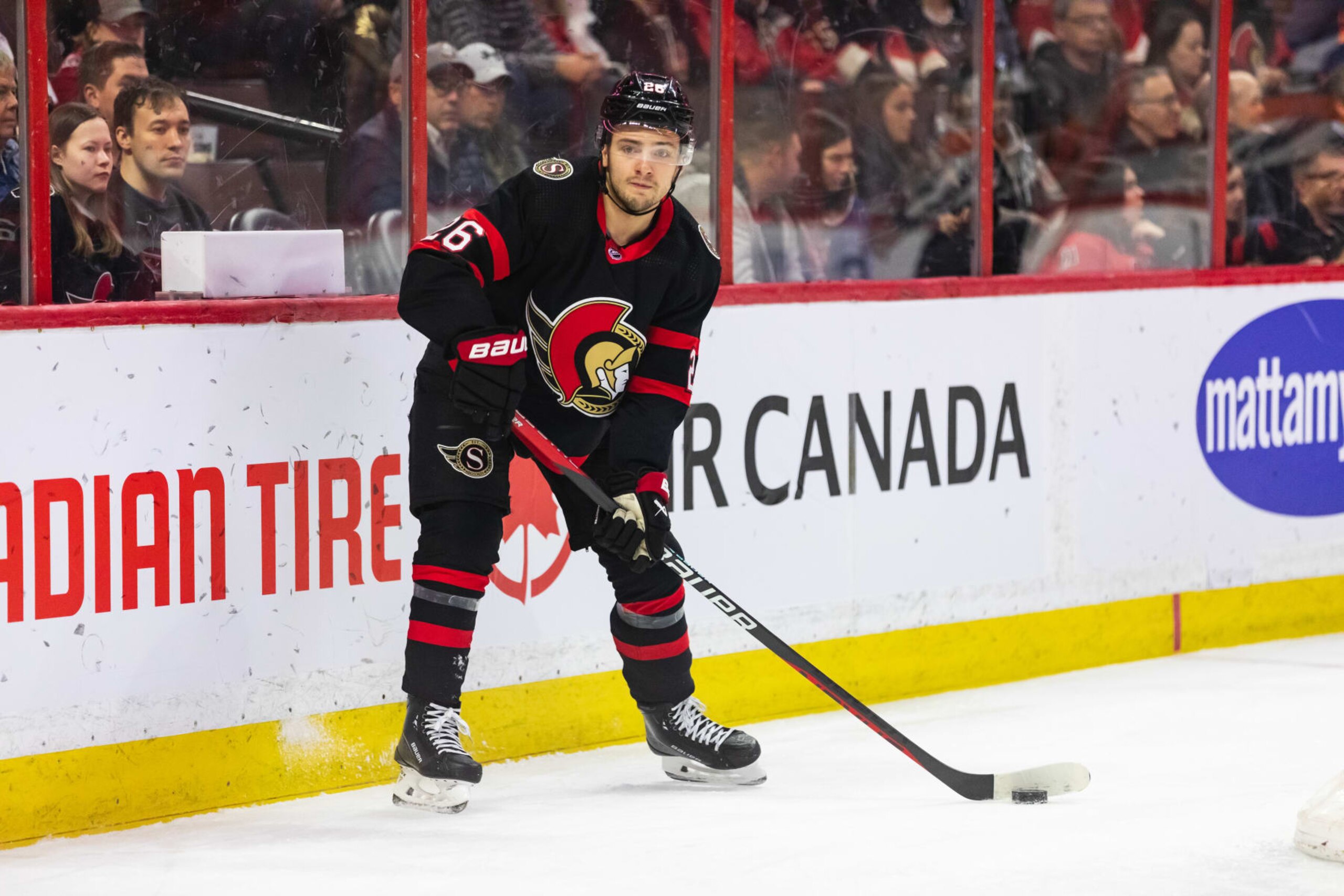 OTTAWA, ON - JANUARY 25: Ottawa Senators Defenceman Erik Brannstrom (26) with the puck during first period National Hockey League action between the New York Islanders and Ottawa Senators on January 25, 2023, at Canadian Tire Centre in Ottawa, ON, Canada. (Photo by Richard A. Whittaker/Icon Sportswire via Getty Images) OTTAWA, ON - JANUARY 25: Ottawa Senators Defenceman Erik Brannstrom (26) with the puck during first period National Hockey League action between the New York Islanders and Ottawa Senators on January 25, 2023, at Canadian Tire Centre in Ottawa, ON, Canada. (Photo by Richard A. Whittaker/Icon Sportswire via Getty Images)
