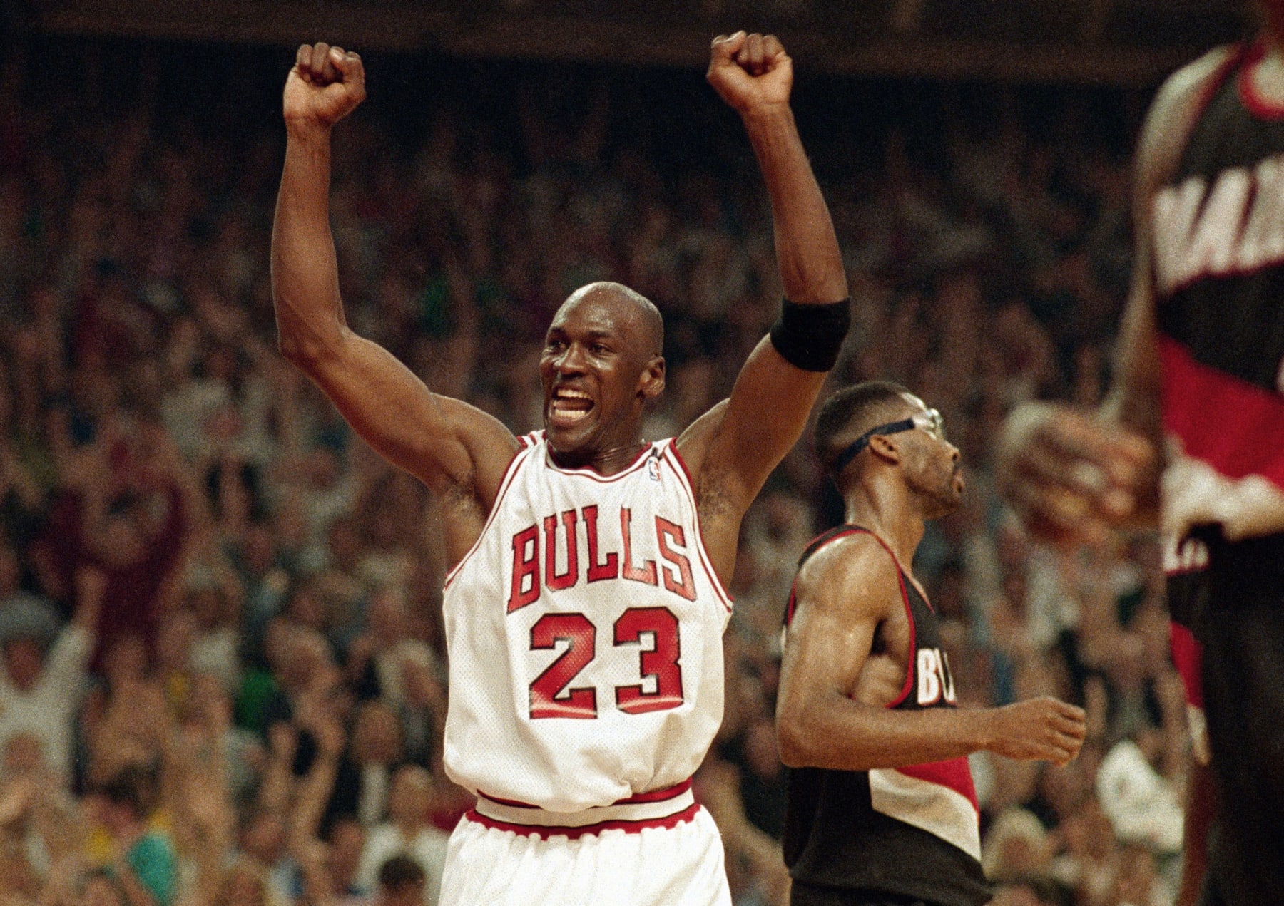 Michael Jordan celebrates the Bulls win over the Portland Trail Blazers in the NBA Finals in Chicago on June 14, 1992. (AP Photo/John Swart, File)