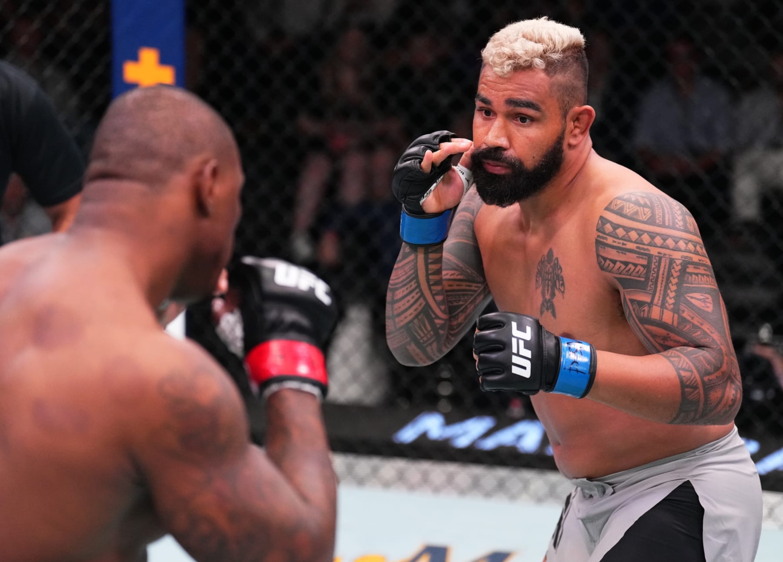 Zac Pauga (right) came up short in his UFC debut.