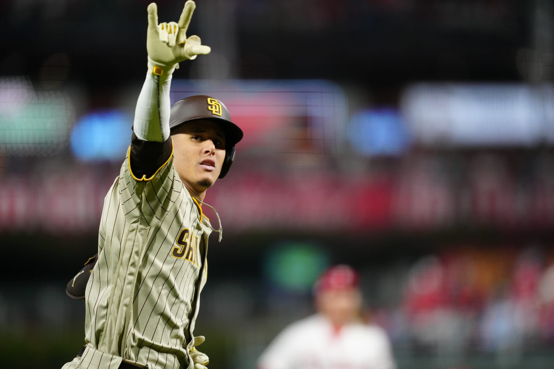 PHILADELPHIA, PA - OCTOBER 22:   Manny Machado #13 of the San Diego Padres reacts while running the bases after hitting a home run in the first inning during Game 4 of the NLCS between the San Diego Padres and the Philadelphia Phillies at Citizens Bank Park on Saturday, October 22, 2022 in Philadelphia, Pennsylvania. (Photo by Daniel Shirey/MLB Photos via Getty Images)