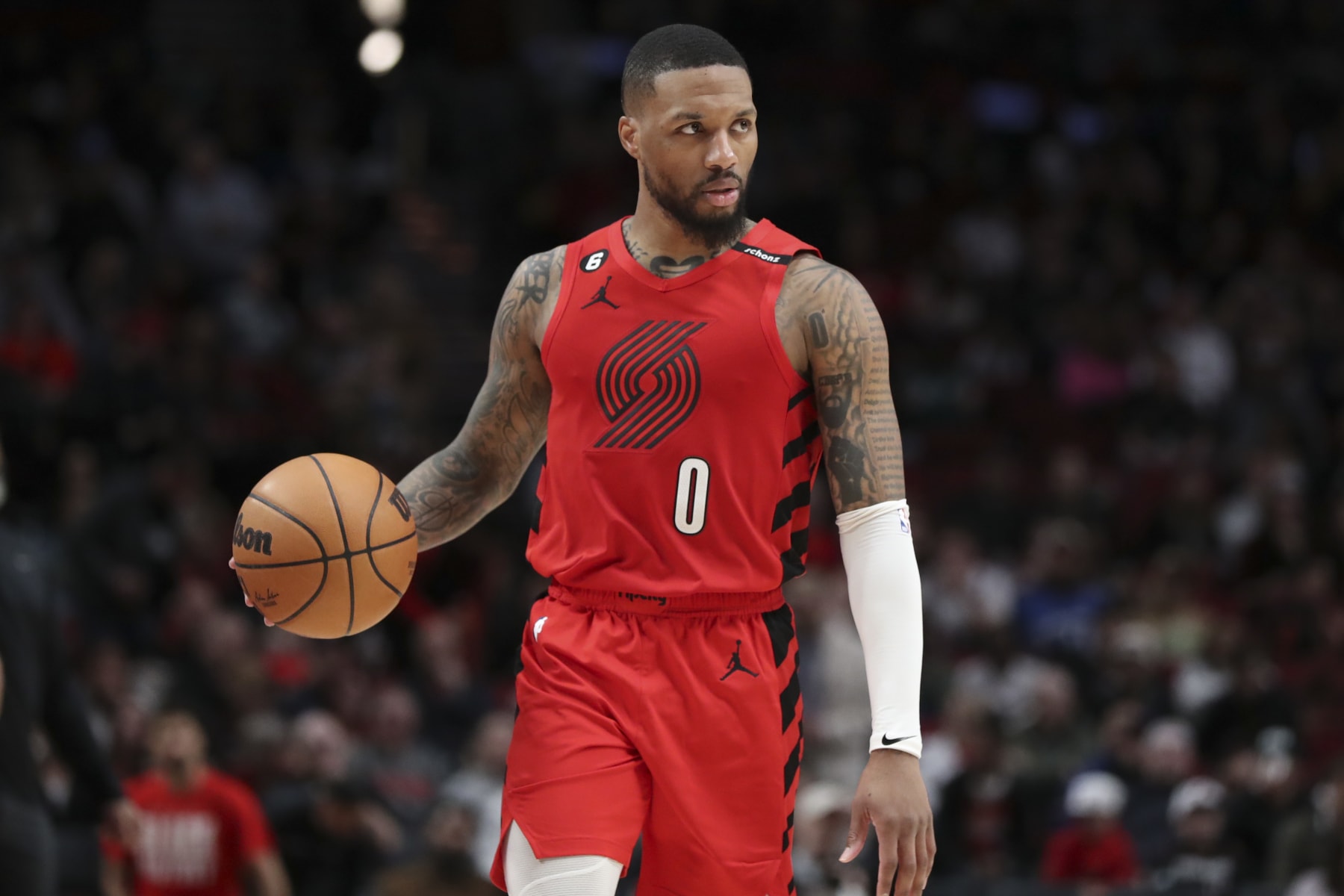 PORTLAND, OREGON - FEBRUARY 14: Damian Lillard #0 of the Portland Trail Blazers brings the ball up the court against the Washington Wizards during the third quarter at Moda Center on February 14, 2023 in Portland, Oregon. NOTE TO USER: User expressly acknowledges and agrees that, by downloading and or using this photograph, user is consenting to the terms and conditions of the Getty Images License Agreement. (Photo by Amanda Loman/Getty Images)