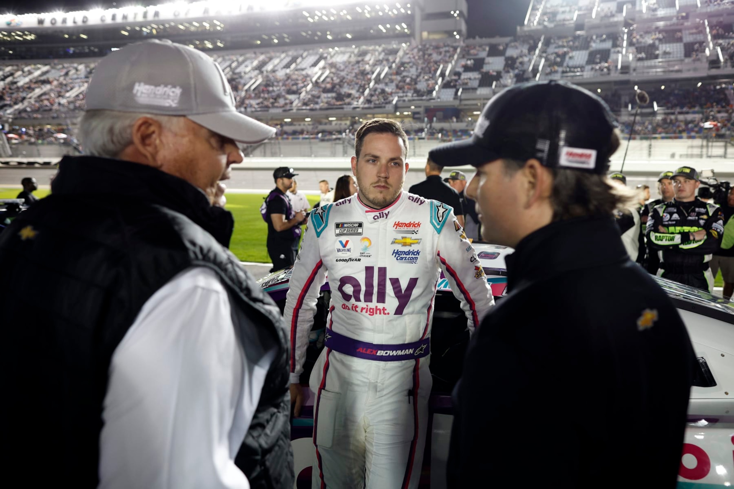 DAYTONA BEACH, FLORIDA - FEBRUARY 16: Alex Bowman, driver of the #48 Ally Chevrolet, speaks to NASCAR Hall of Famer and team owner Rick Hendrick (L) and Jeff Gordon, Vice Chairman of Hendrick Motorsports on the grid prior to the NASCAR Cup Series Bluegreen Vacations Duel #1 at Daytona International Speedway on February 16, 2023 in Daytona Beach, Florida. (Photo by Chris Graythen/Getty Images)