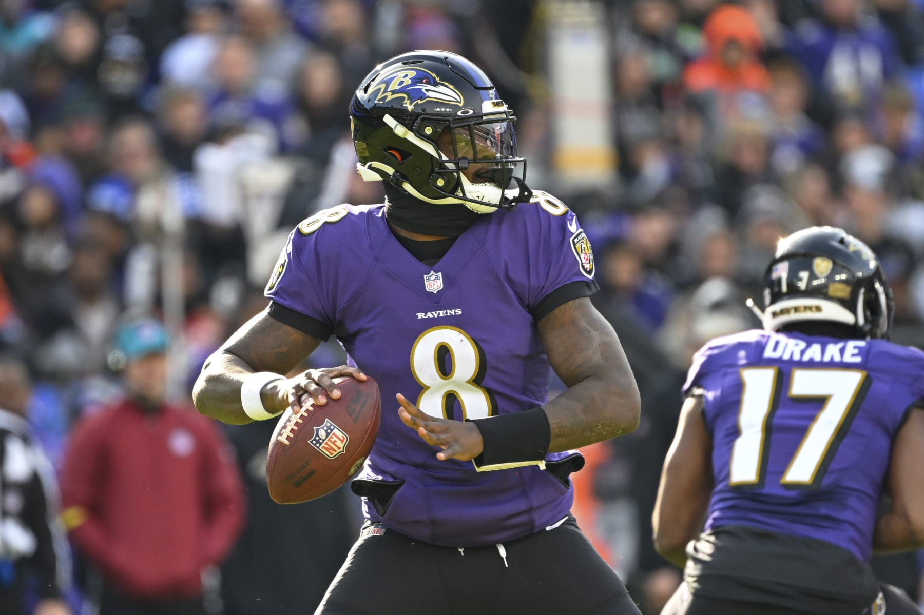 Baltimore Ravens quarterback Lamar Jackson (8) looks to pass the ball during the first half of an NFL football game against the Denver Broncos, Sunday, Dec. 4, 2022, in Baltimore. (AP Photo/Terrance Williams)