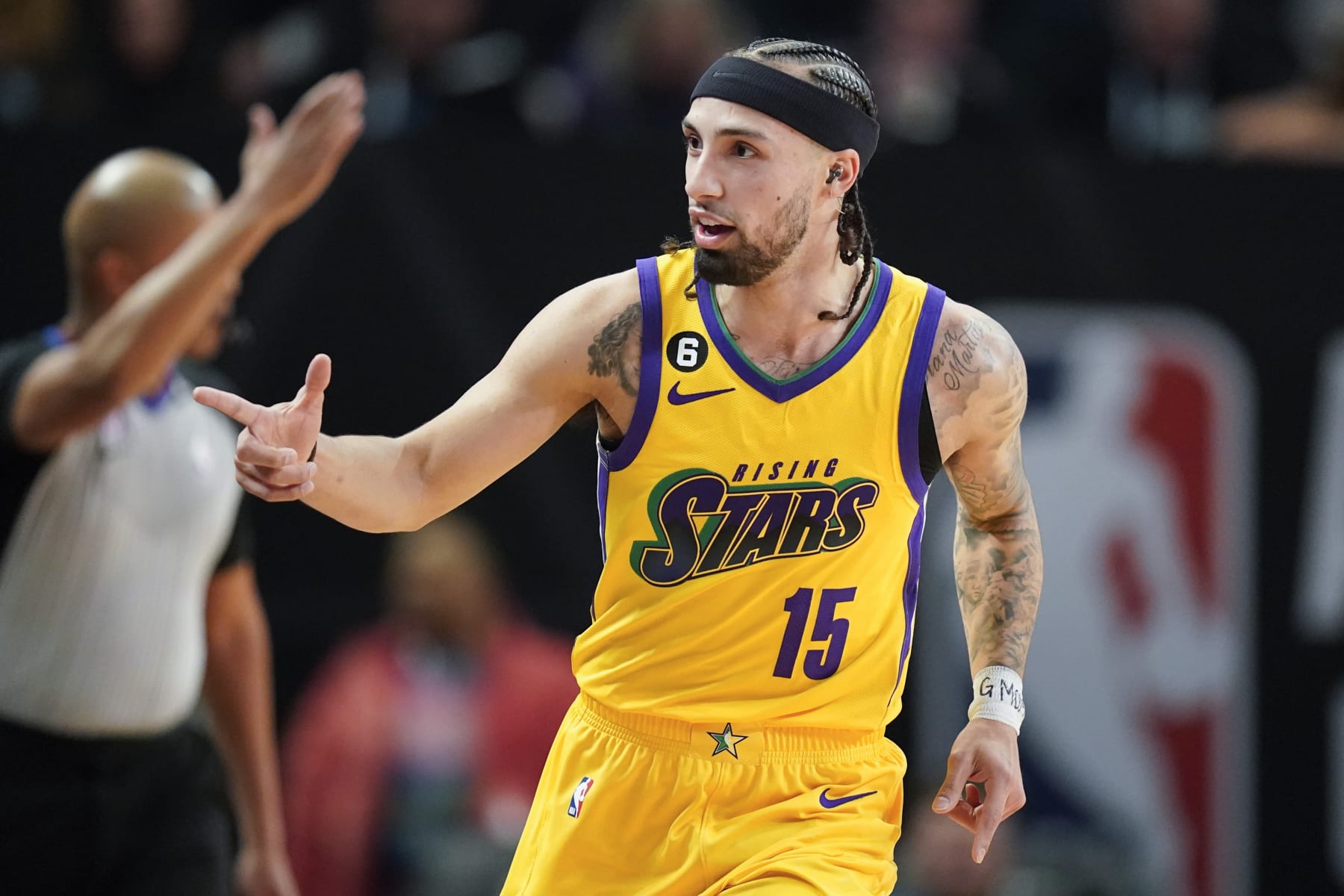 Team Pau Gasol's Jose Alvarado, of the New Orleans Pelicans, points to the bench during an NBA Rising Stars semifinal basketball game against Team Deron Williams, Friday, Feb. 17, 2023, in Salt Lake City. (AP Photo/Rick Bowmer)