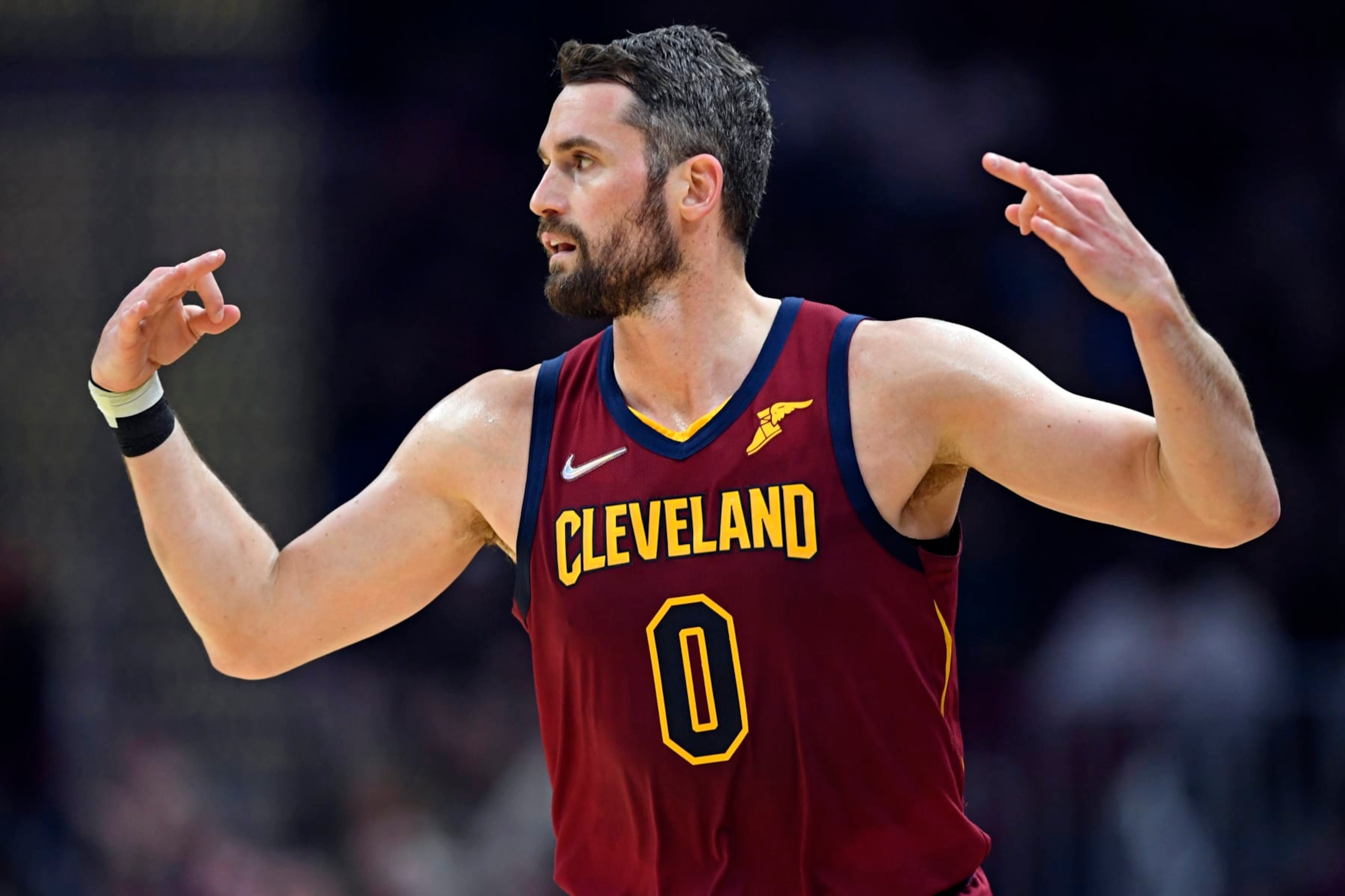Cleveland Cavaliers forward Kevin Love celebrates after a 3-point basket in the first half of an NBA basketball game against the Milwaukee Bucks, Sunday, April 10, 2022, in Cleveland. (AP Photo/David Dermer)