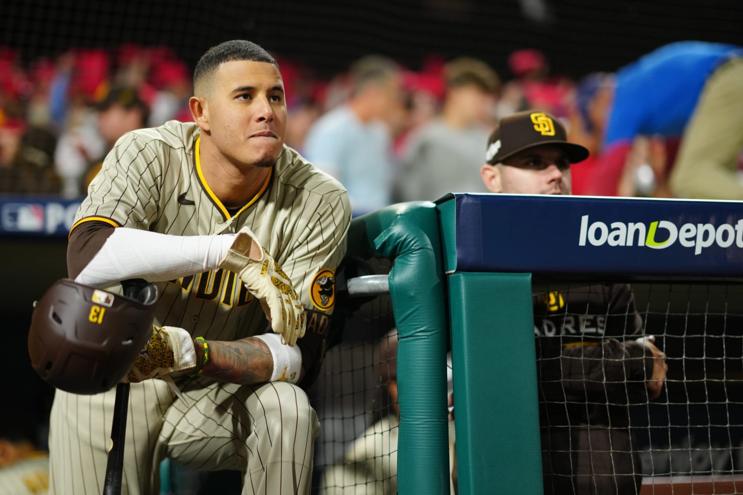 PHILADELPHIA, PA - OCTOBER 22: Manny Machado #13 of the San Diego Padres looks on from the dugout in the first inning during Game 4 of the NLCS between the San Diego Padres and the Philadelphia Phillies at Citizens Bank Park on Saturday, October 22, 2022 in Philadelphia, Pennsylvania. (Photo by Daniel Shirey/MLB Photos via Getty Images) PHILADELPHIA, PA - OCTOBER 22: Manny Machado #13 of the San Diego Padres looks on from the dugout in the first inning during Game 4 of the NLCS between the San Diego Padres and the Philadelphia Phillies at Citizens Bank Park on Saturday, October 22, 2022 in Philadelphia, Pennsylvania. (Photo by Daniel Shirey/MLB Photos via Getty Images)