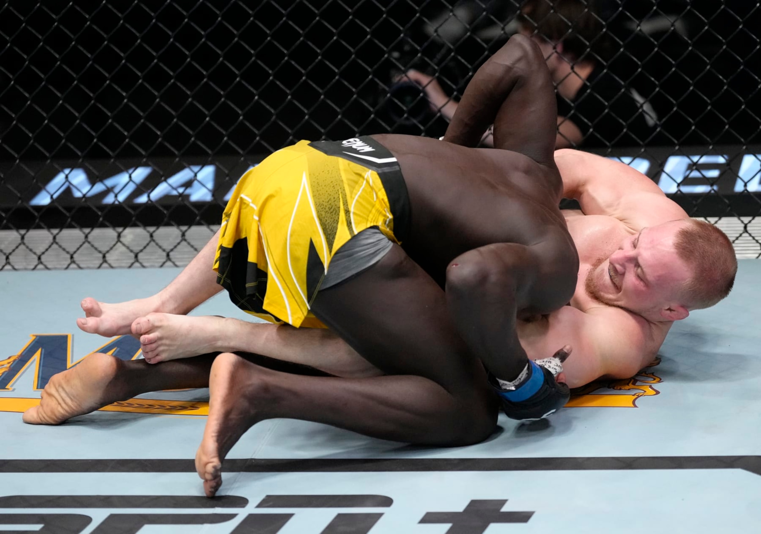 LAS VEGAS, NEVADA - FEBRUARY 18: (R-L) AJ Fletcher secures a guillotine choke submission against Themba Gorimbo of Zimbabwe in a welterweight fight during the UFC Fight Night event at UFC APEX on February 18, 2023 in Las Vegas, Nevada. (Photo by Jeff Bottari/Zuffa LLC via Getty Images)