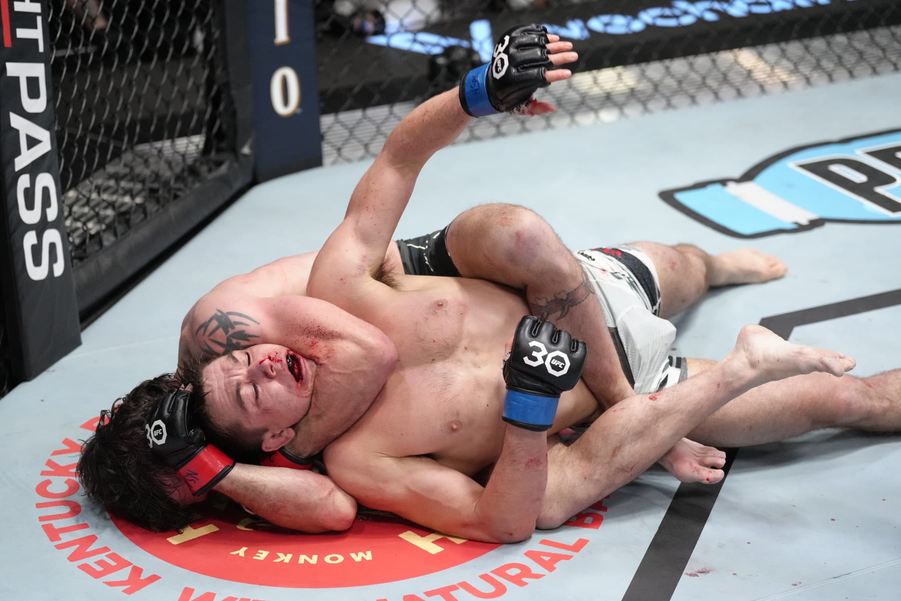 LAS VEGAS, NEVADA - FEBRUARY 18: (L-R) Jim Miller attempts to secure a rear choke submission against Alexander Hernandez in a lightweight fight during the UFC Fight Night event at UFC APEX on February 18, 2023 in Las Vegas, Nevada. (Photo by Jeff Bottari/Zuffa LLC via Getty Images)
