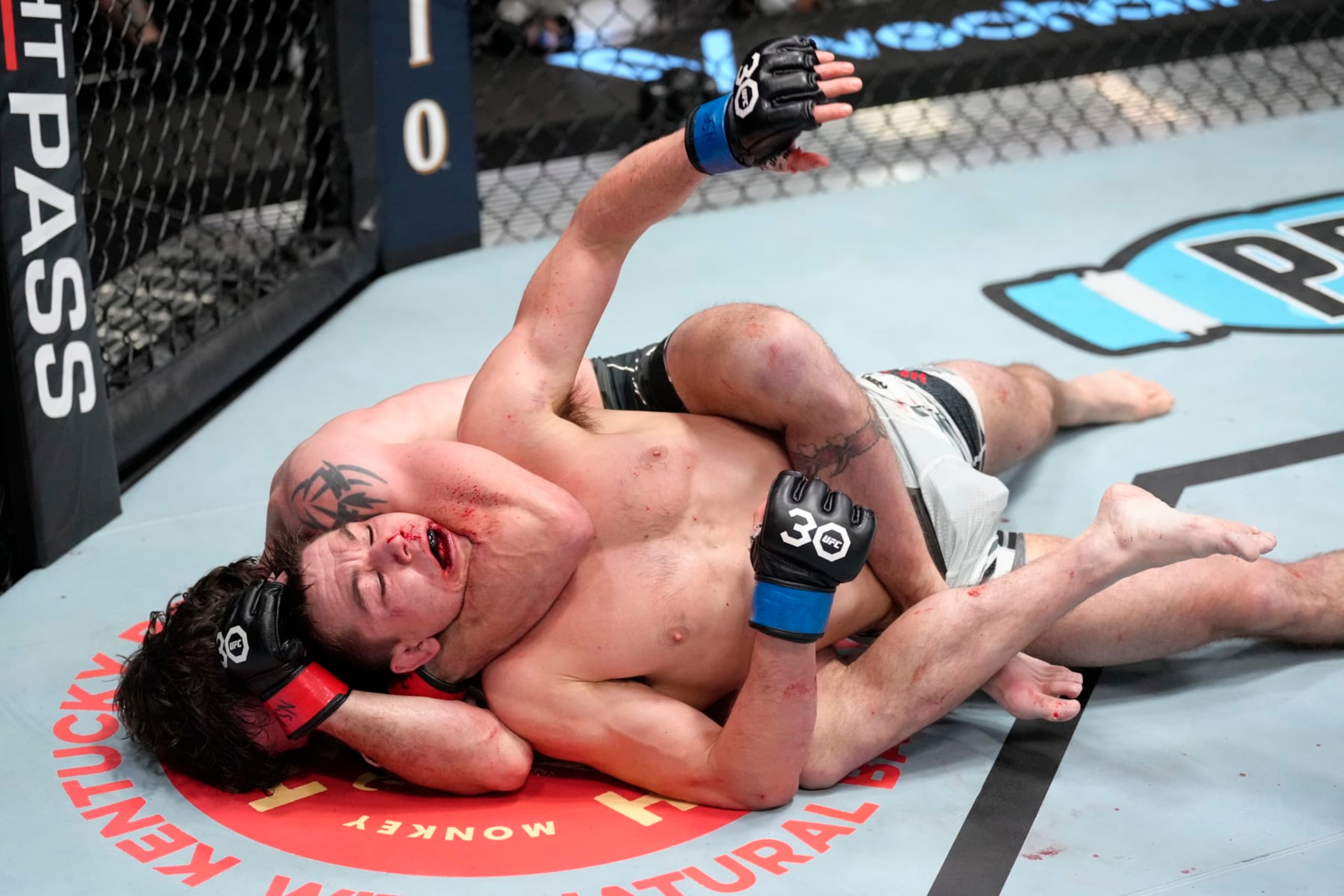 LAS VEGAS, NEVADA - FEBRUARY 18: (L-R) Jim Miller attempts to secure a rear choke submission against Alexander Hernandez in a lightweight fight during the UFC Fight Night event at UFC APEX on February 18, 2023 in Las Vegas, Nevada. (Photo by Jeff Bottari/Zuffa LLC via Getty Images)