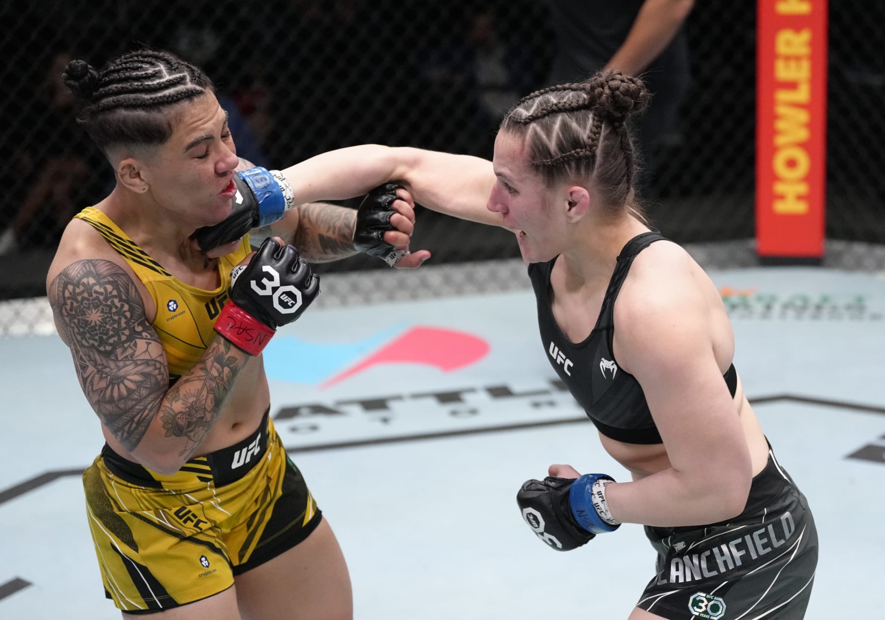 LAS VEGAS, NEVADA - FEBRUARY 18: (R-L) Erin Blanchfield punches Jessica Andrade of Brazil in a flyweight fight during the UFC Fight Night event at UFC APEX on February 18, 2023 in Las Vegas, Nevada. (Photo by Jeff Bottari/Zuffa LLC via Getty Images)