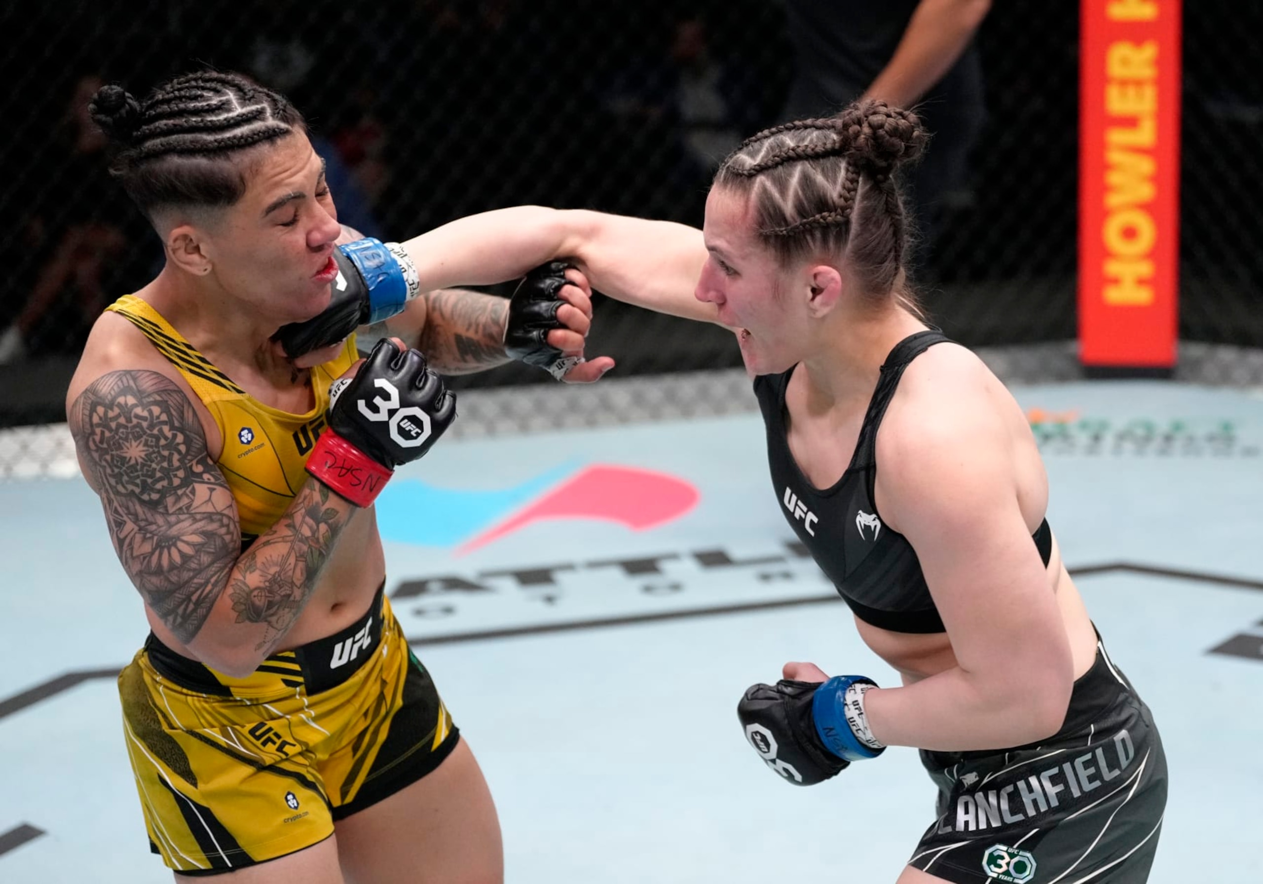 LAS VEGAS, NEVADA - FEBRUARY 18: (R-L) Erin Blanchfield punches Jessica Andrade of Brazil in a flyweight fight during the UFC Fight Night event at UFC APEX on February 18, 2023 in Las Vegas, Nevada. (Photo by Jeff Bottari/Zuffa LLC via Getty Images)
