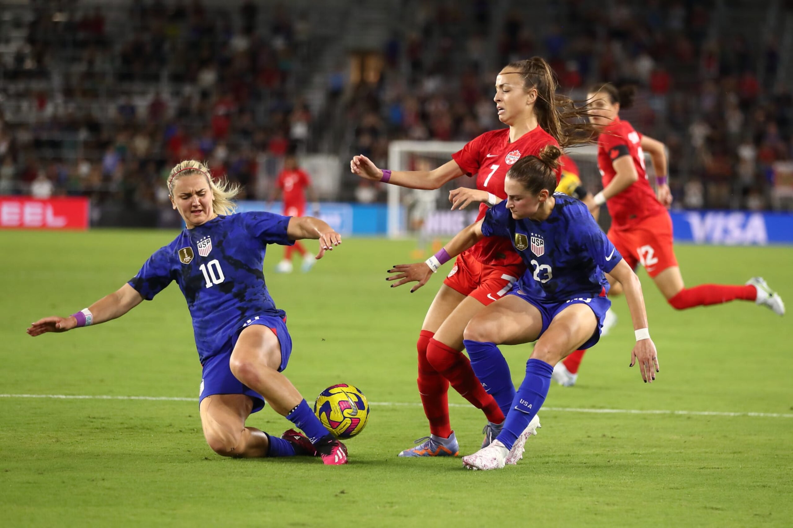 ORLANDO, FL - FEBRUARY 16: Lindsey Horan of United States of America and Julia Grosso of Canada and Emily Fox of United States of America during the 2023 SheBelieves Cup match between Canada and United States at Exploria Stadium on February 16, 2023 in Orlando, Florida. (Photo by James Williamson - AMA/Getty Images)