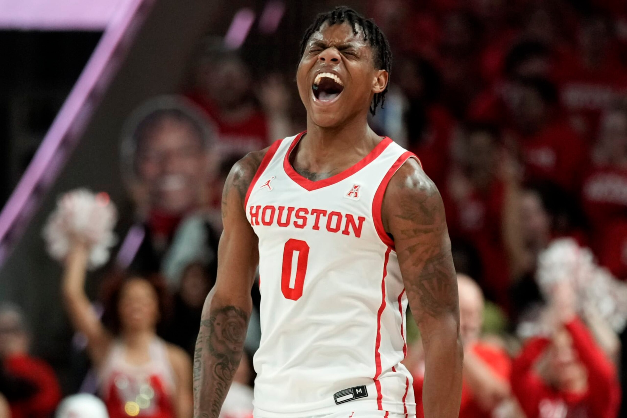 Houston guard Marcus Sasser reacts after making a 3-point basket during the first half of the team's NCAA college basketball game against Tulsa, Wednesday, Feb. 8, 2023, in Houston. (AP Photo/Eric Christian Smith)