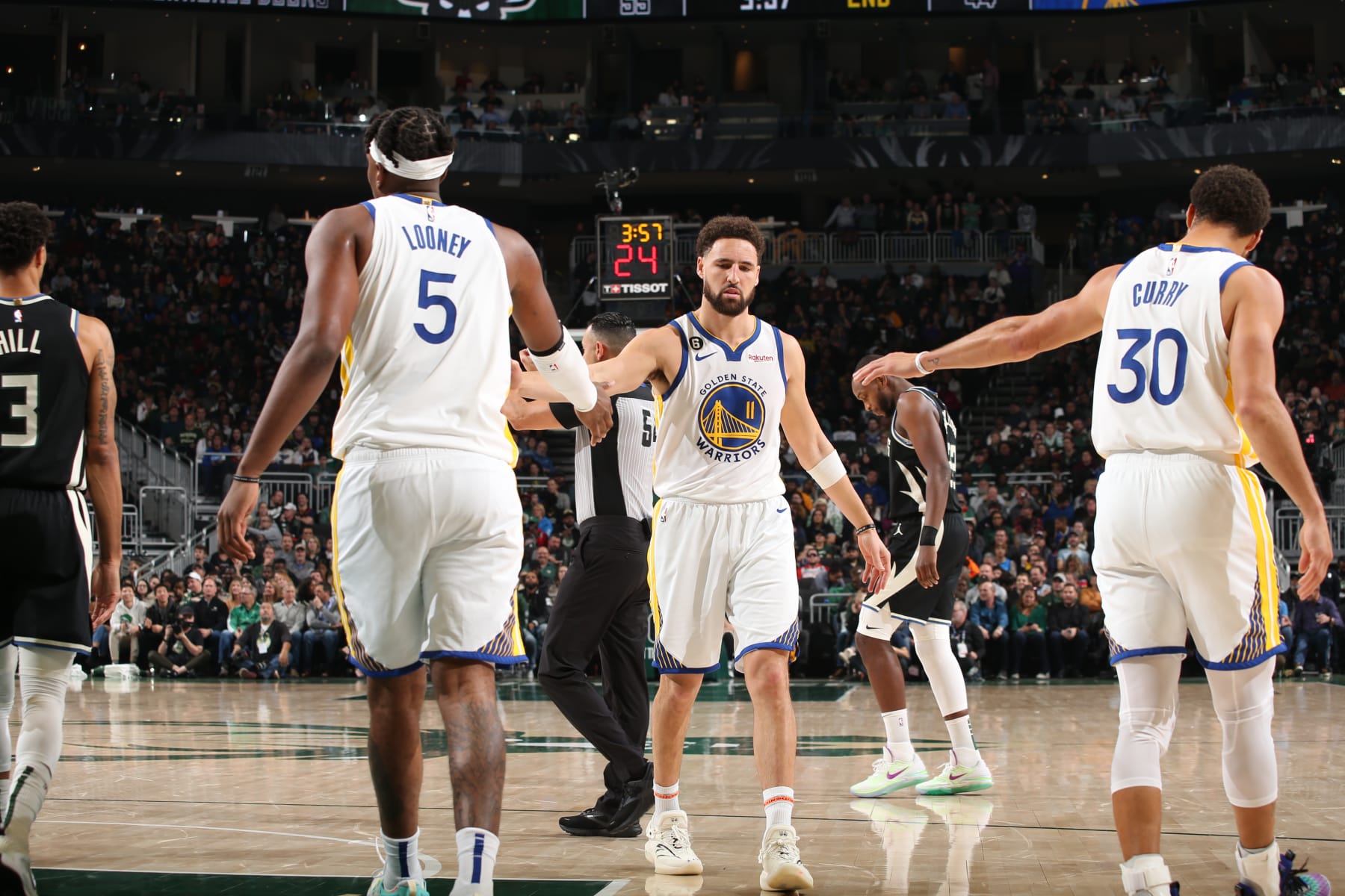 Kevon Looney, Klay Thompson and Stephen Curry