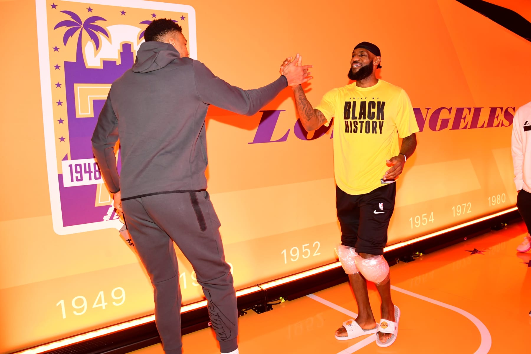 LOS ANGELES, CA - FEBRUARY 9: LeBron James #6 of the Los Angeles Lakers greets Giannis Antetokounmpo #34 of the Milwaukee Bucks before the game on February 9, 2023 at Crypto.Com Arena in Los Angeles, California. NOTE TO USER: User expressly acknowledges and agrees that, by downloading and/or using this Photograph, user is consenting to the terms and conditions of the Getty Images License Agreement. Mandatory Copyright Notice: Copyright 2023 NBAE (Photo by Adam Pantozzi/NBAE via Getty Images)