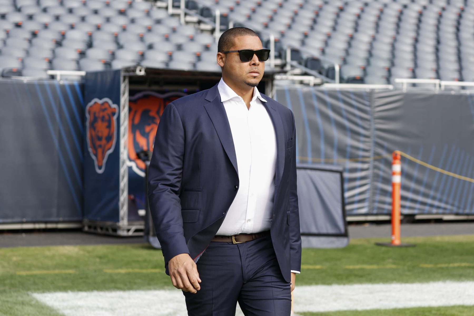 Chicago Bears NFL football team general manager Ryan Poles walks on the field prior to an NFL football game between the Chicago Bears and Miami Dolphins, Sunday, Nov. 6, 2022, in Chicago. (AP Photo/Kamil Krzaczynski)