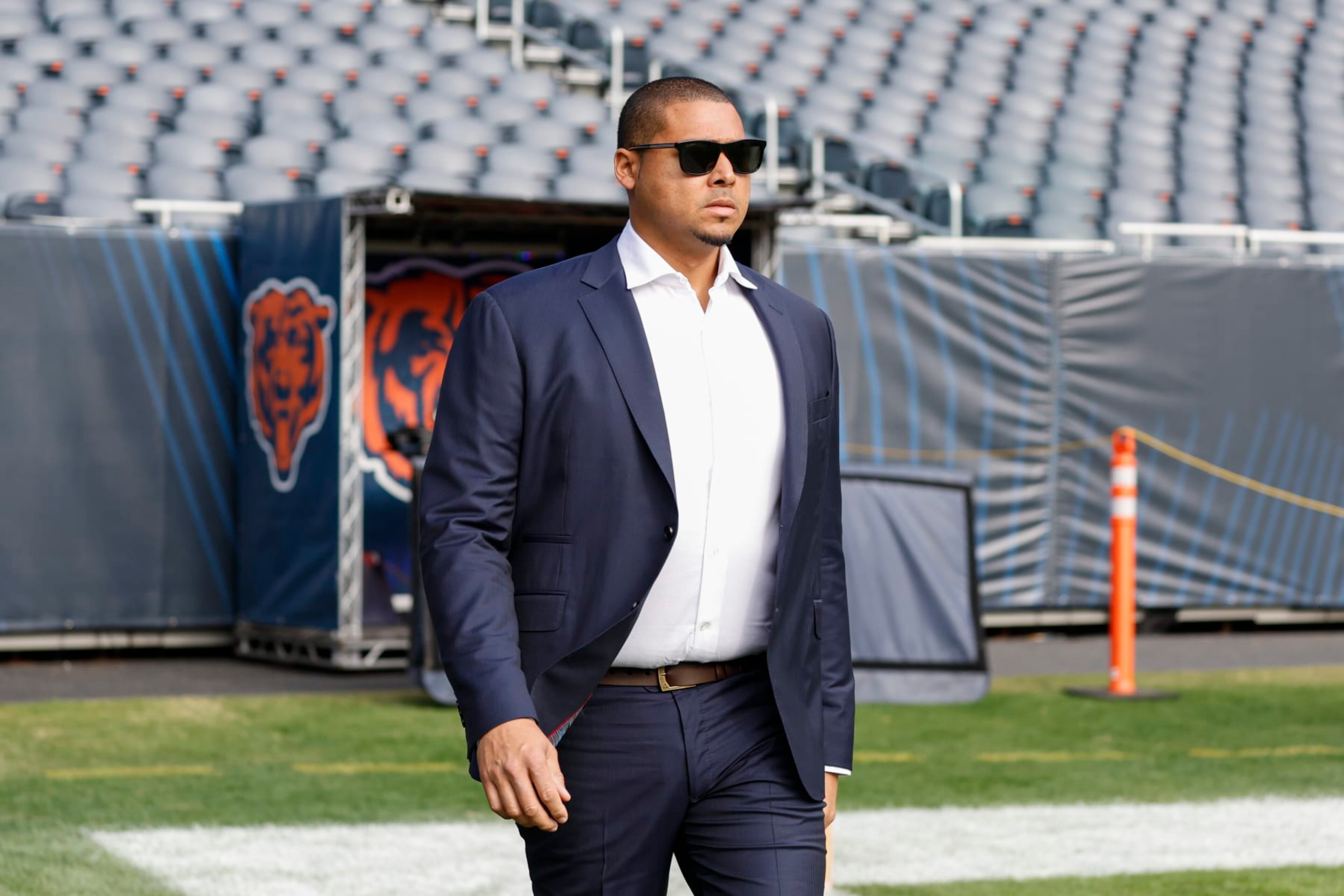 Chicago Bears NFL football team general manager Ryan Poles walks on the field prior to an NFL football game between the Chicago Bears and Miami Dolphins, Sunday, Nov. 6, 2022, in Chicago. (AP Photo/Kamil Krzaczynski)