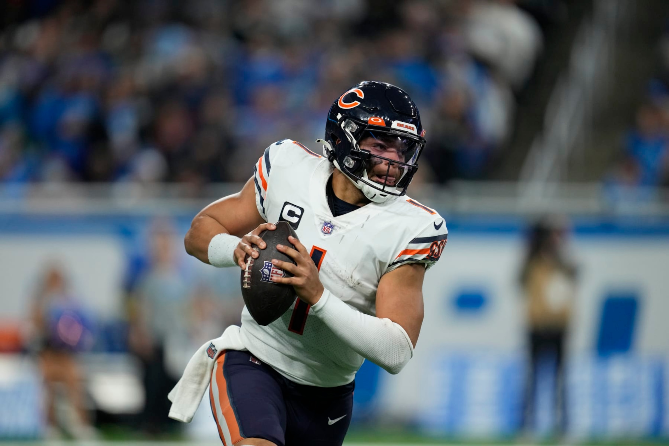 Chicago Bears quarterback Justin Fields plays during the second half of an NFL football game against the Detroit Lions, Sunday, Jan. 1, 2023, in Detroit. (AP Photo/Paul Sancya)