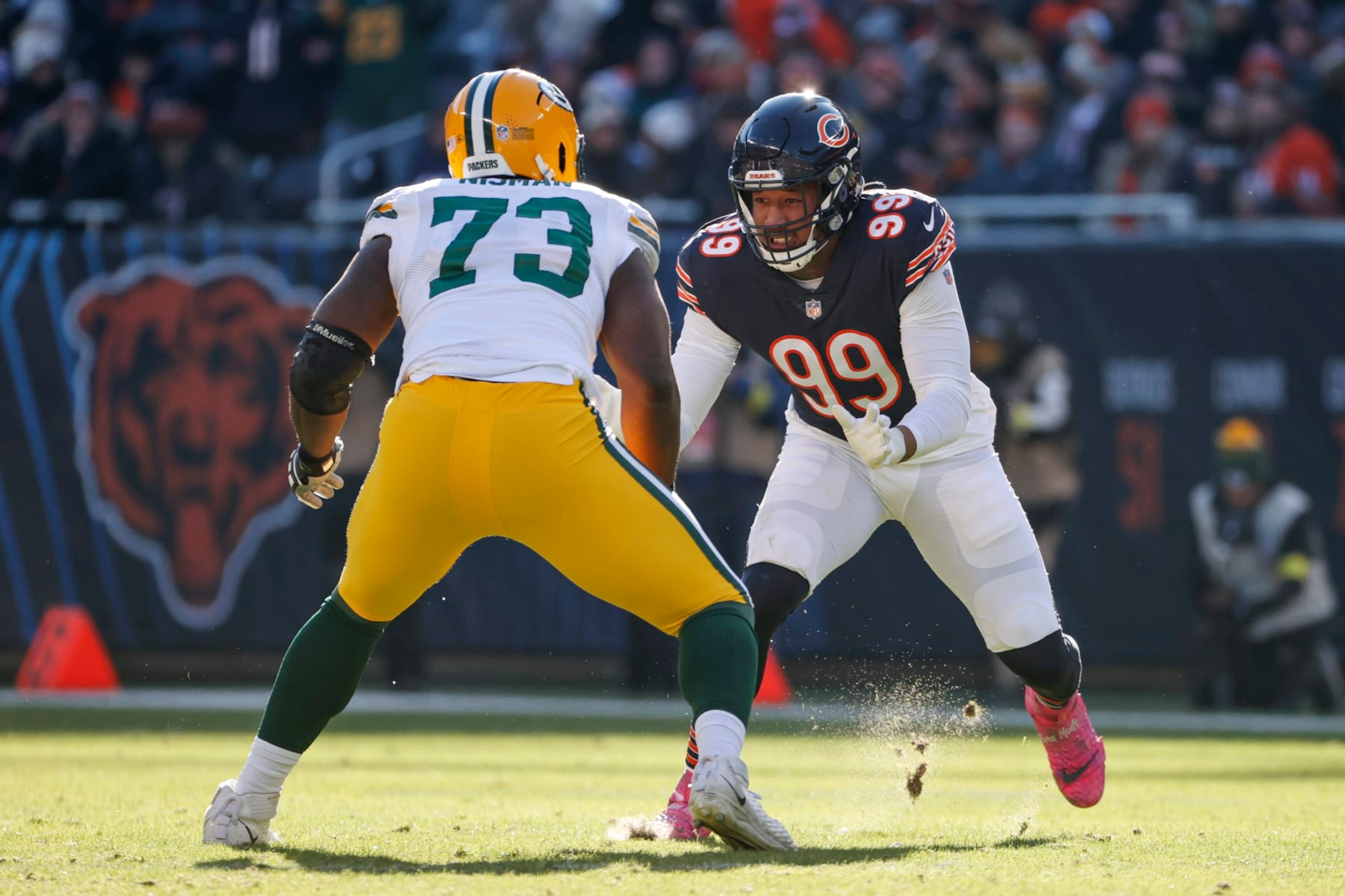 Chicago Bears linebacker Trevis Gipson (99) blocks against Green Bay Packers offensive tackle Yosh Nijman (73) during the first half of an NFL football game, Sunday, Dec. 4, 2022, in Chicago. (AP Photo/Kamil Krzaczynski)
